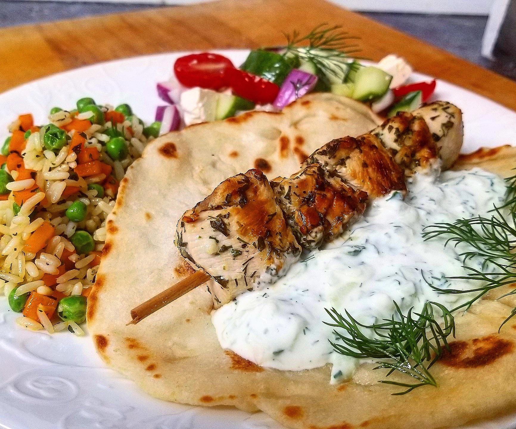 Greek lunch Chicken souvlaki, homemade pita and tzatziki, greek rice