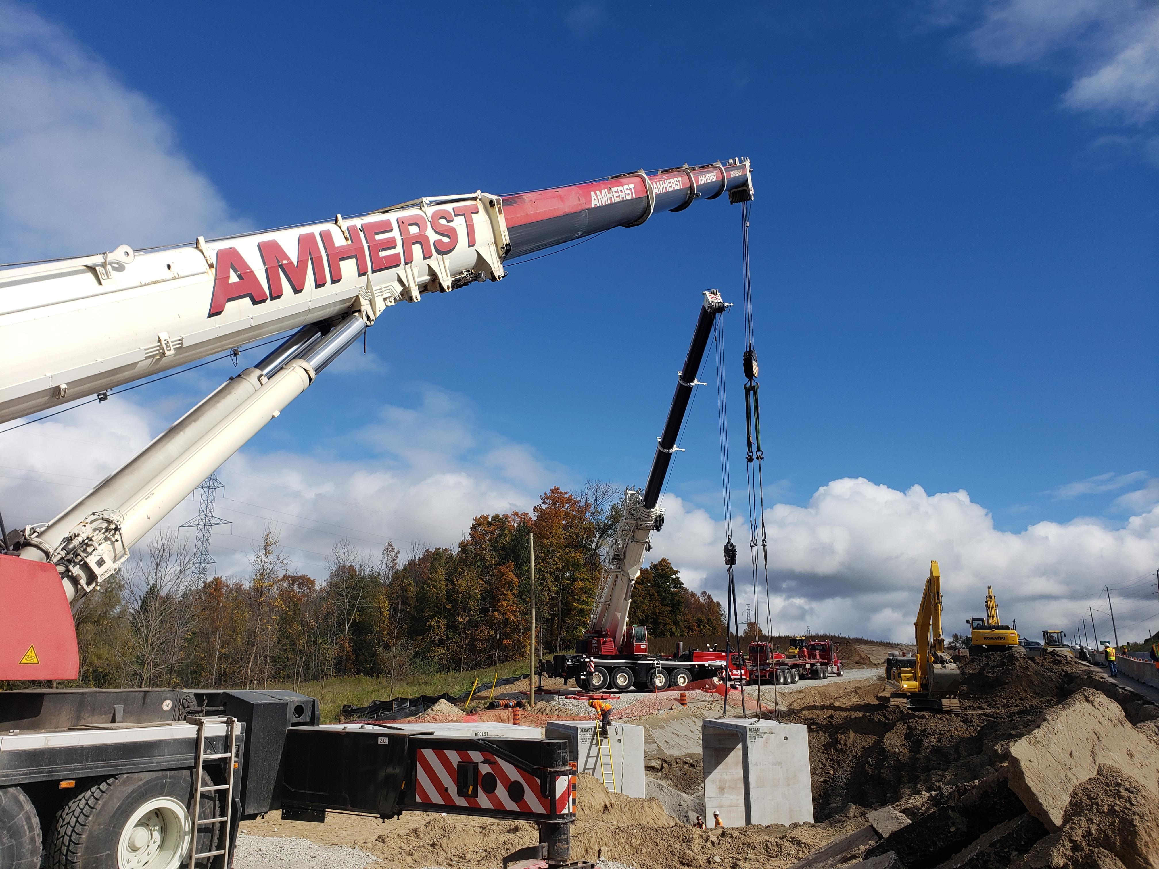 2 cranes lift massive box culvert r/Construction