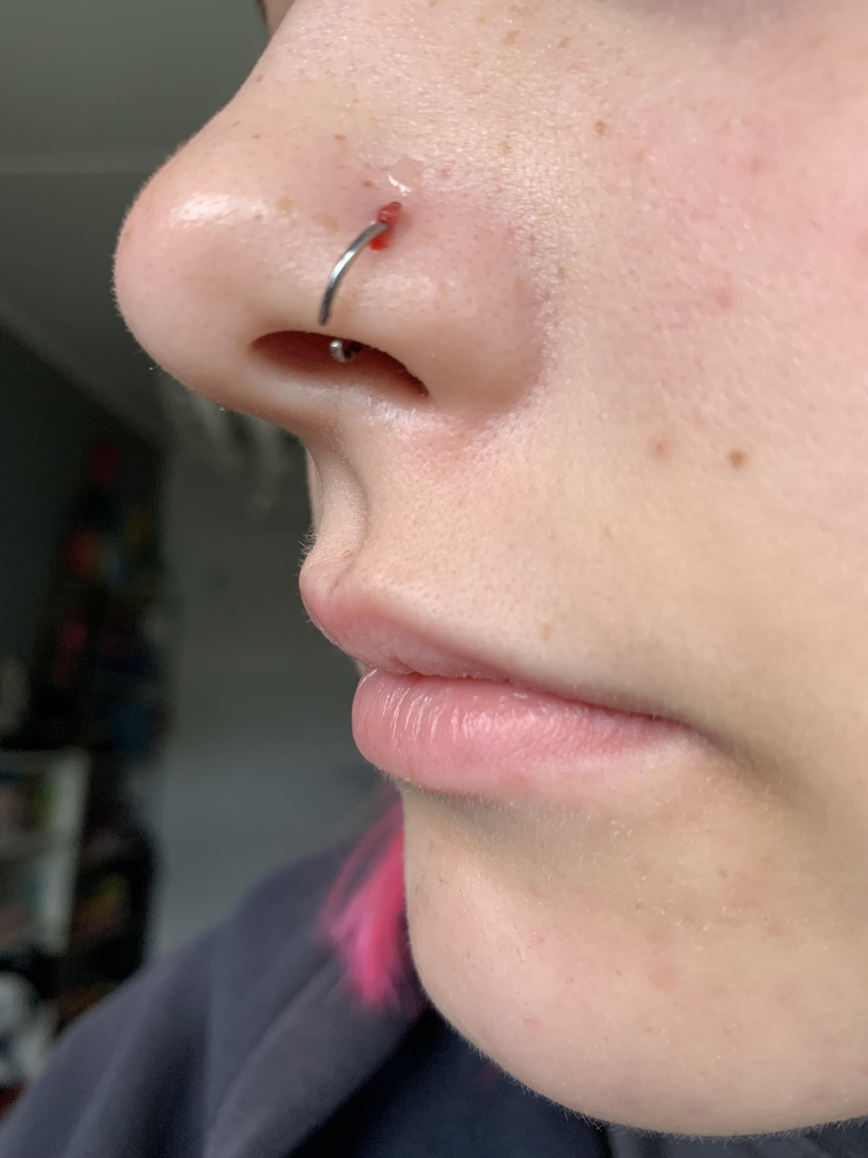 I got my nose pierced 3 week ago, but it still bleeds. What should I do