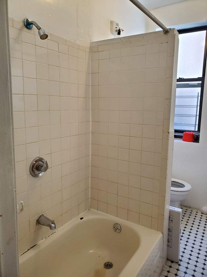 Need help with this shower, any way to move the shower head over to the wall seen here so it can