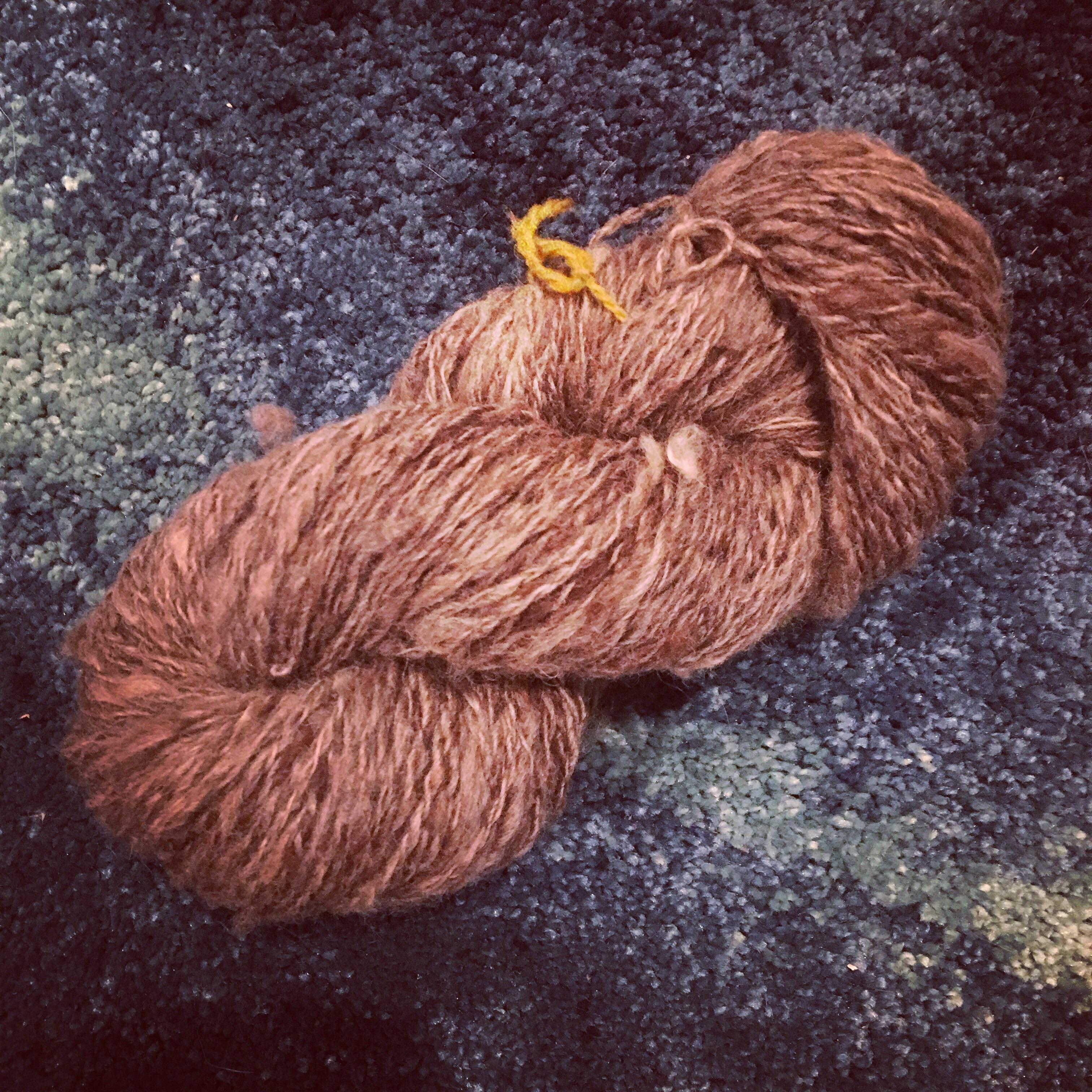 Just finished spinning my very first hank of yarn! I watched it come
