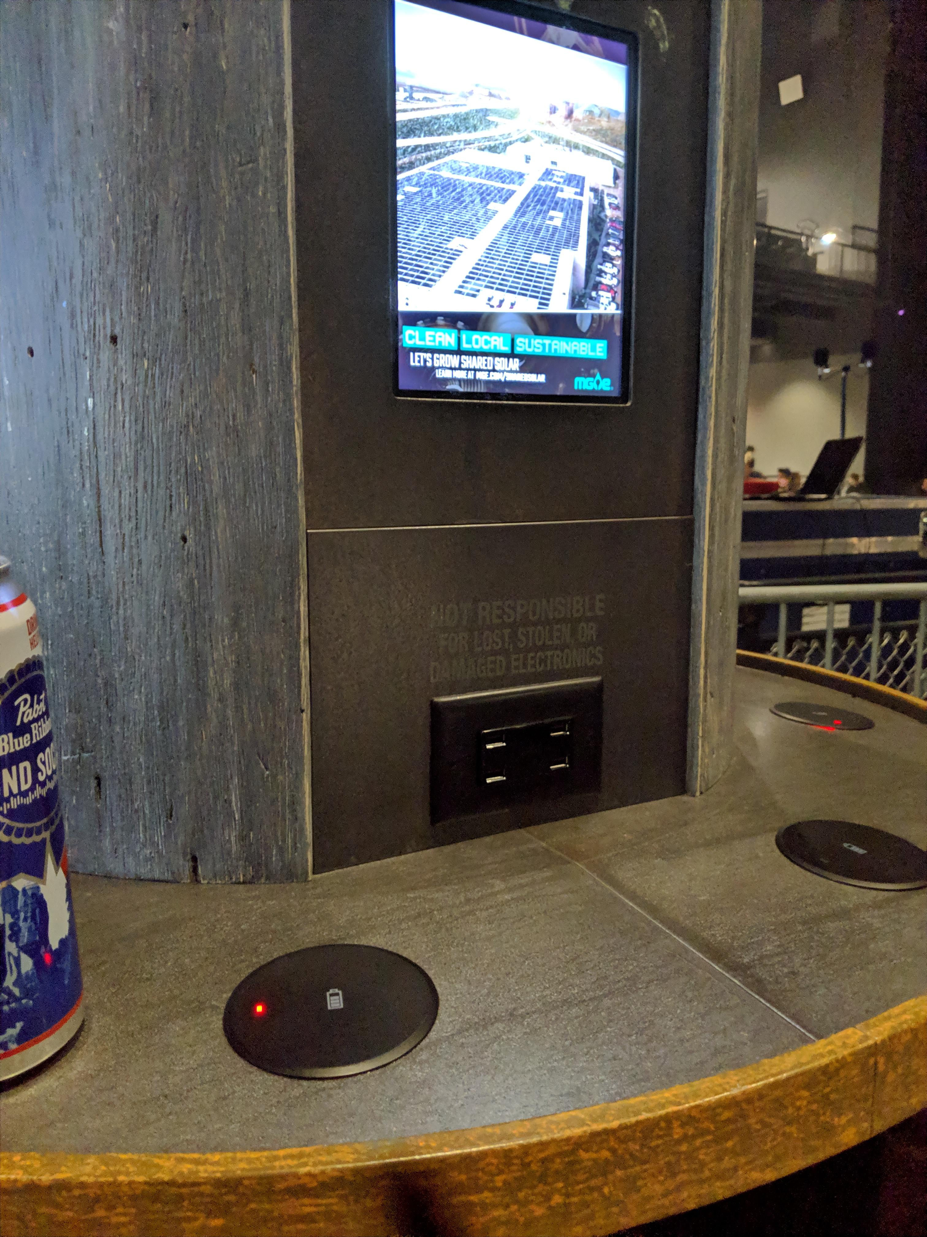Phone charging station at a concert venue r/mildlyinteresting