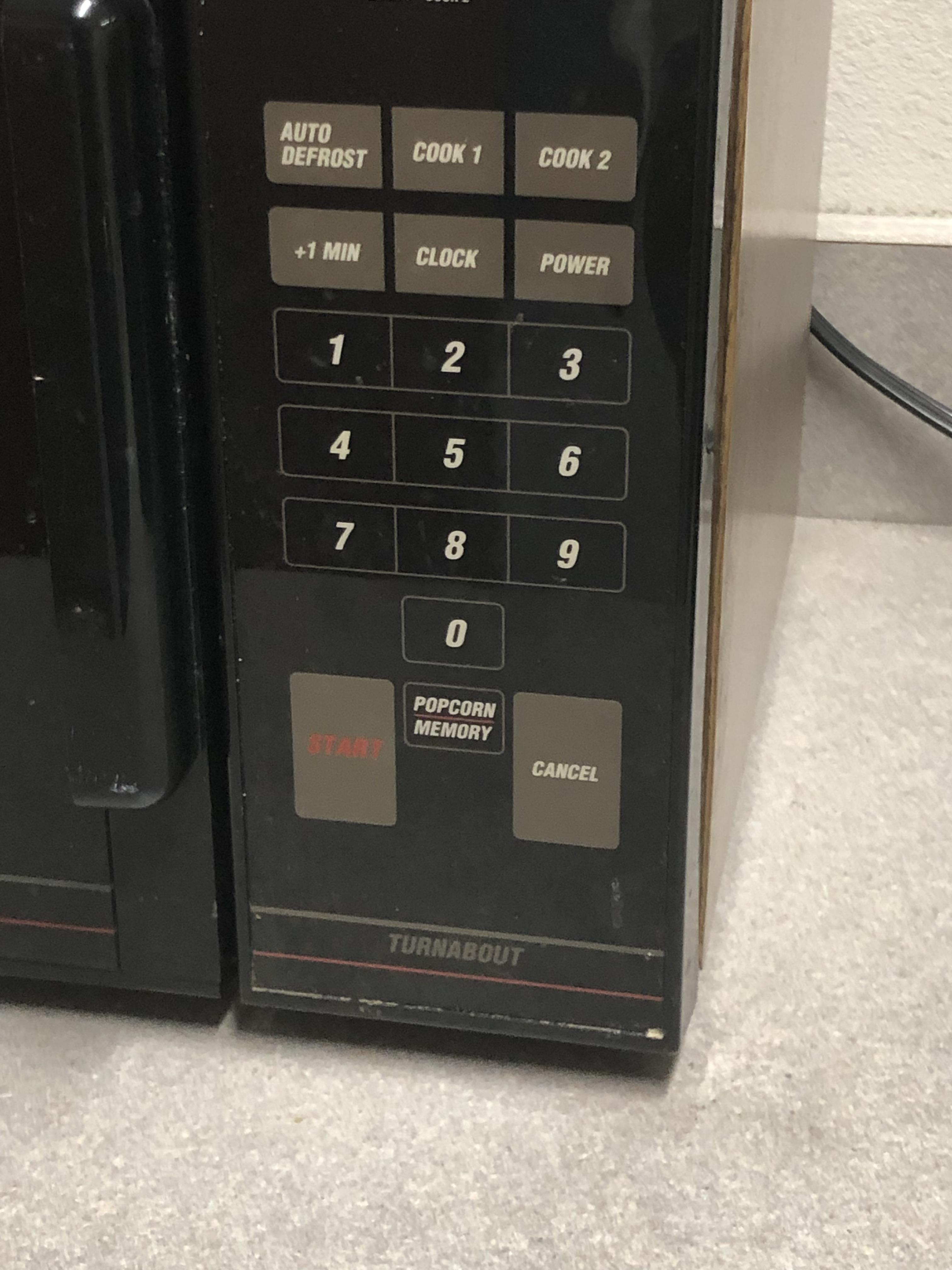 This microwave with the start button res and cancel button white r