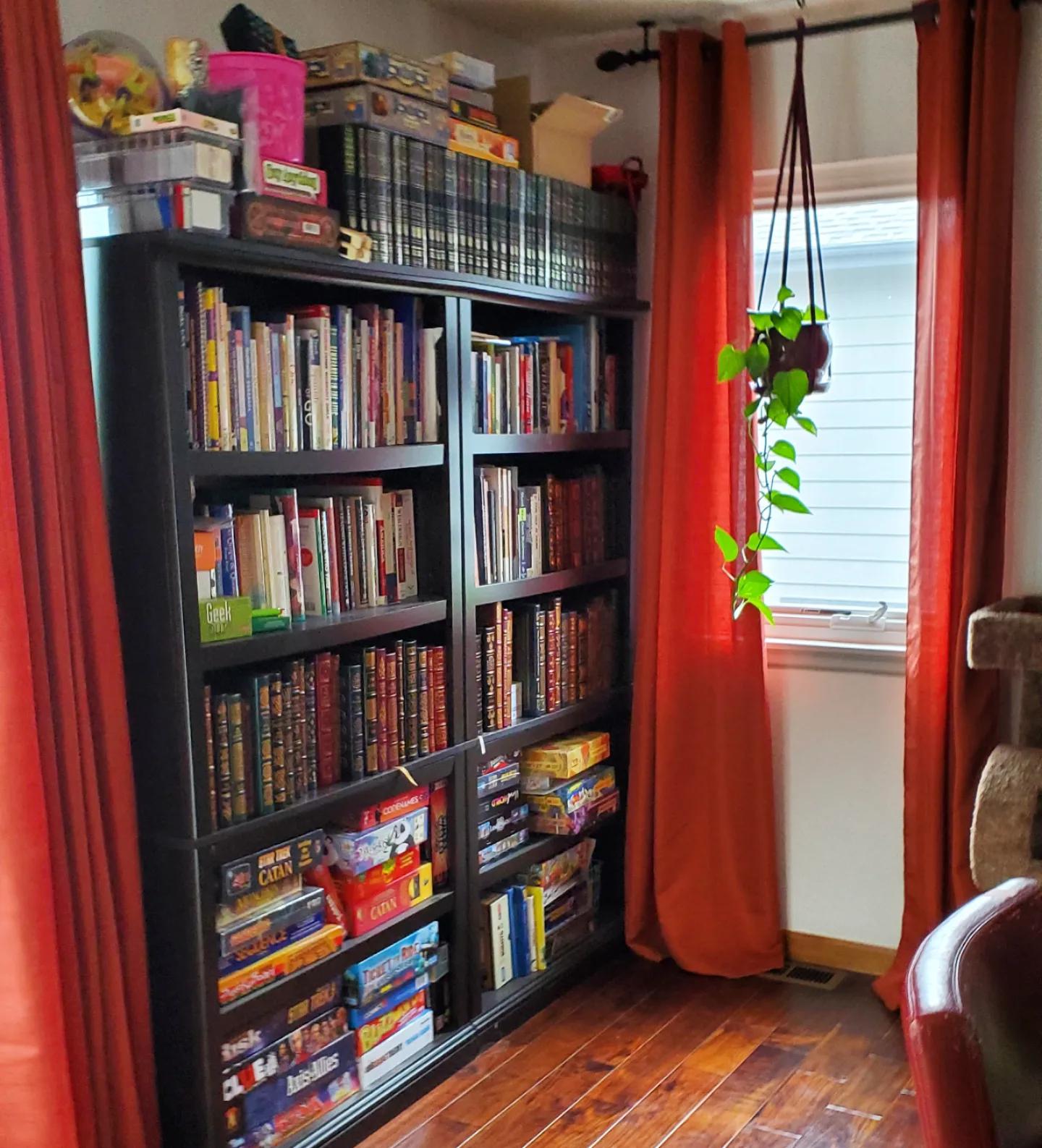 When both books and board games fight for space on the bookshelves. 😄