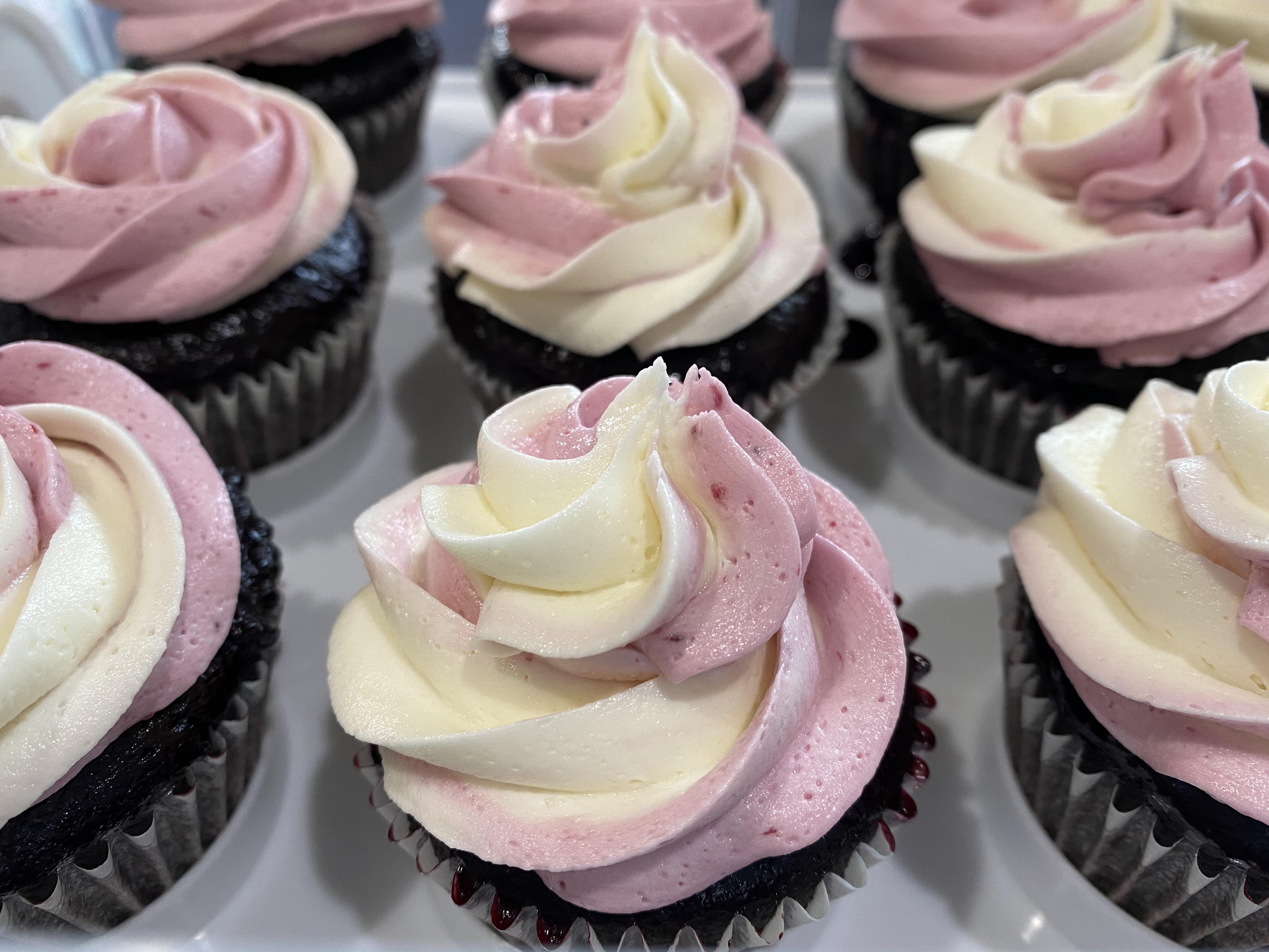 Ganache filled cupcakes, brushed with blackberry syrup , topped with