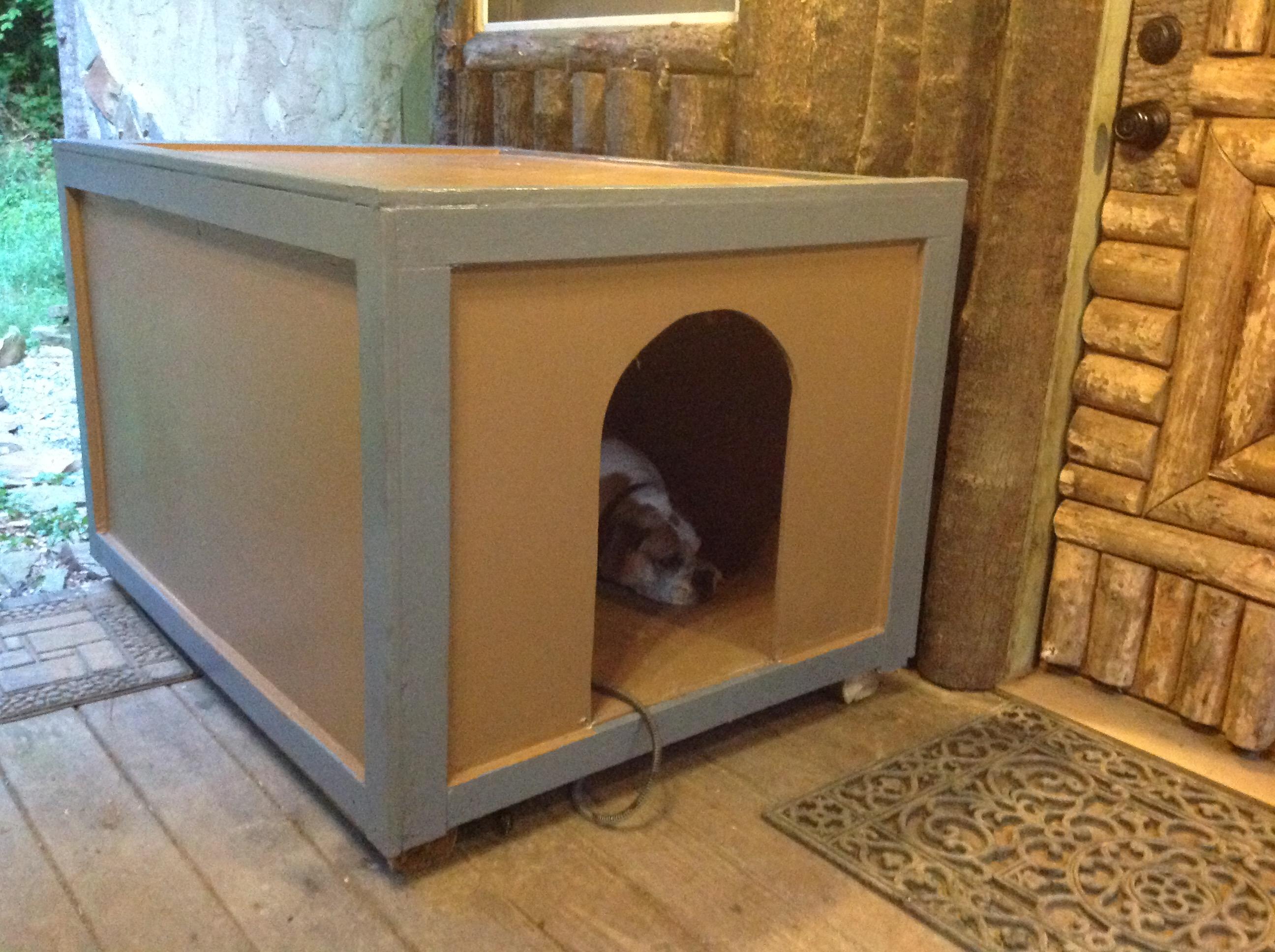 Otto the boxer enjoying his new dog house...it is large enough to share