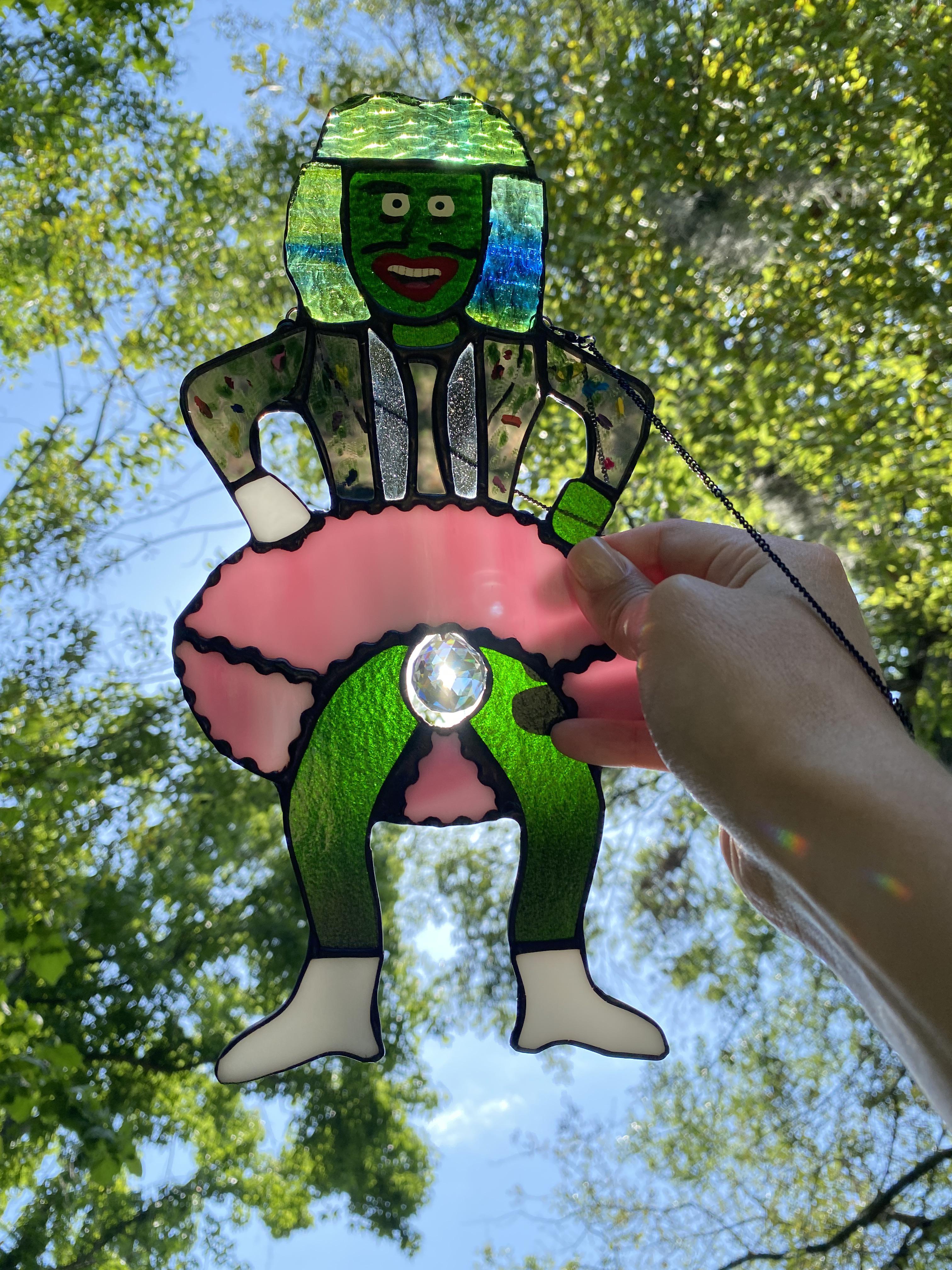 Behold the mangina! My Old Greg stained glass piece, my most prized