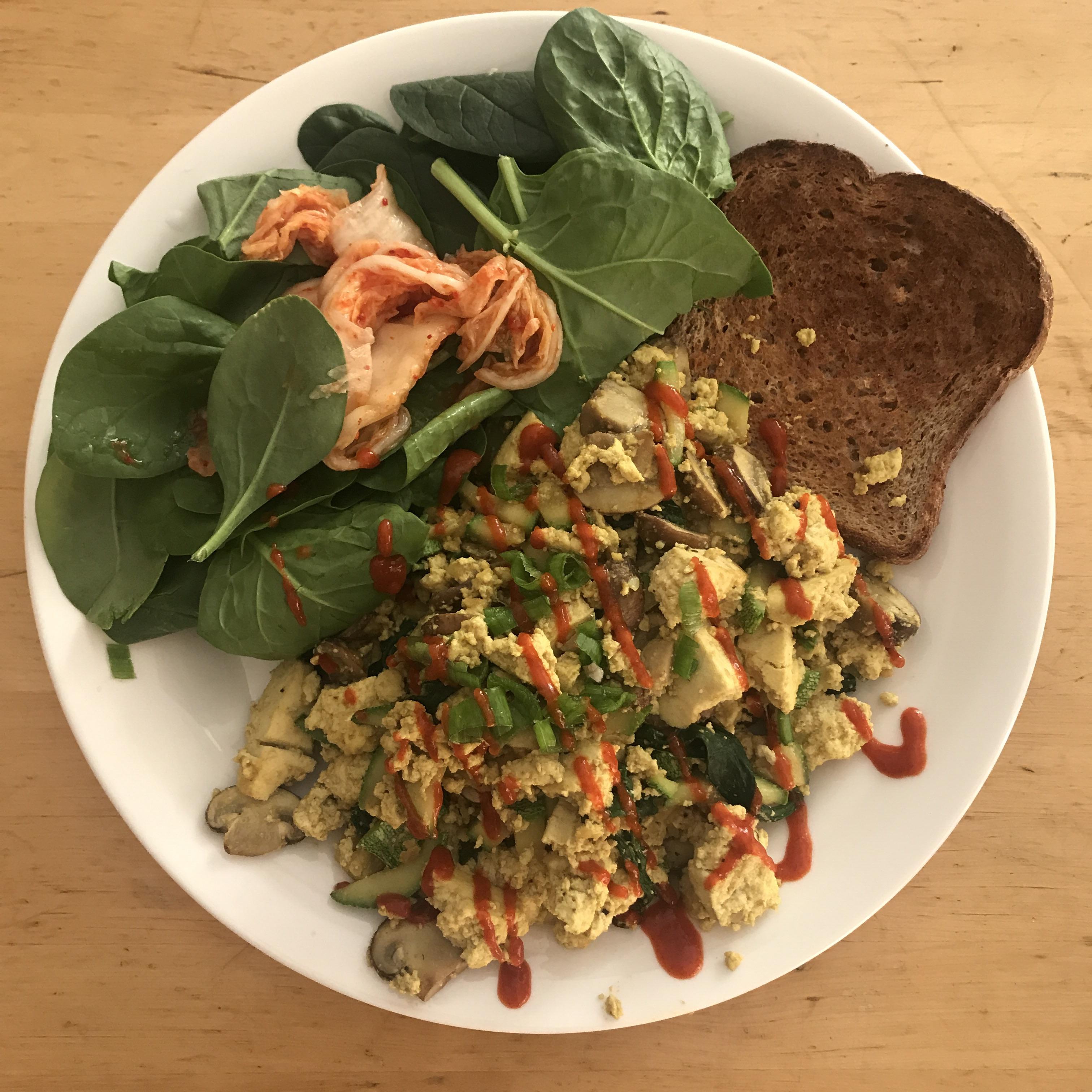 Mushroom zucchini tofu scramble with spinach, kimchi, green onions and