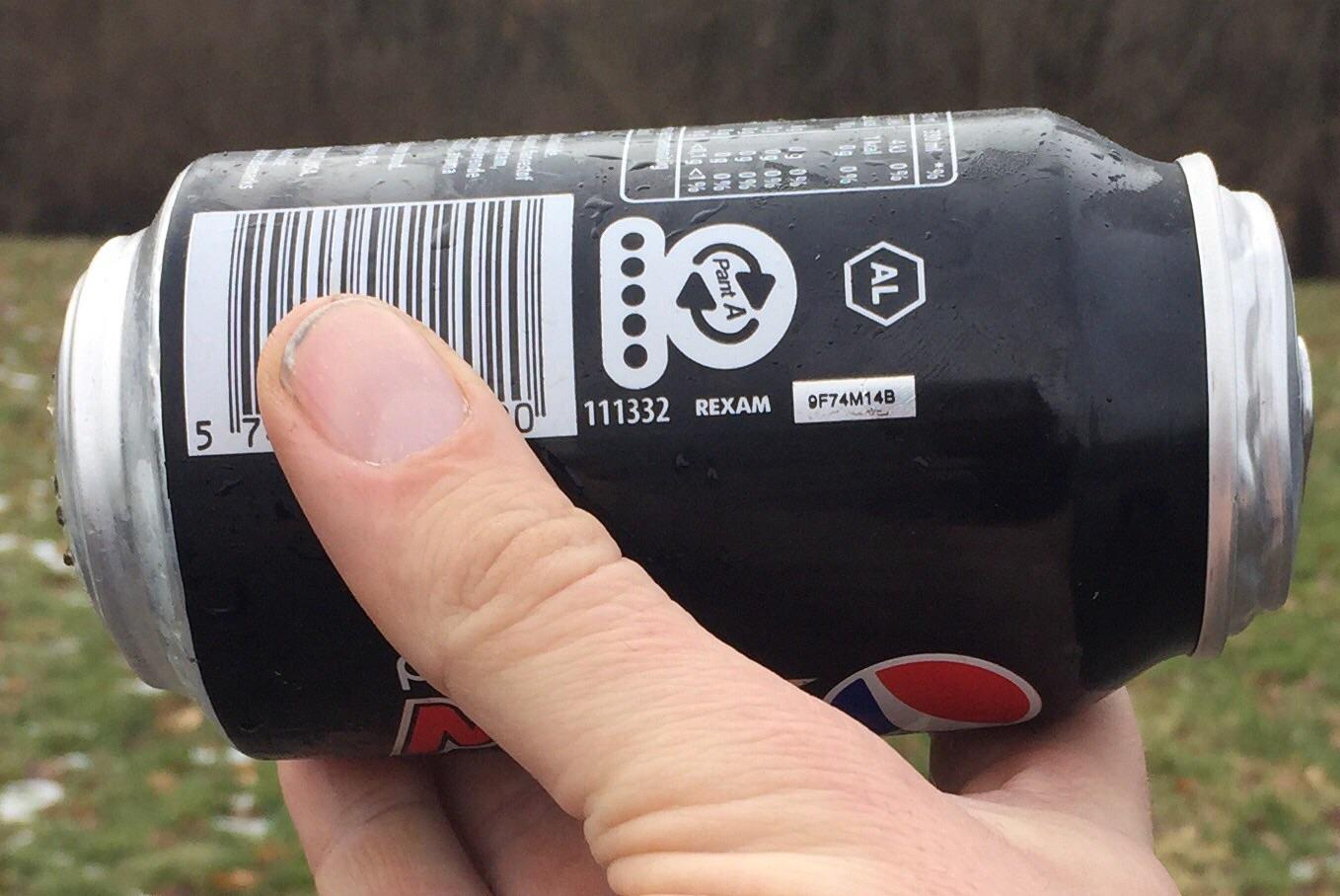 This soda can expanded due to the beverage inside freezing. r