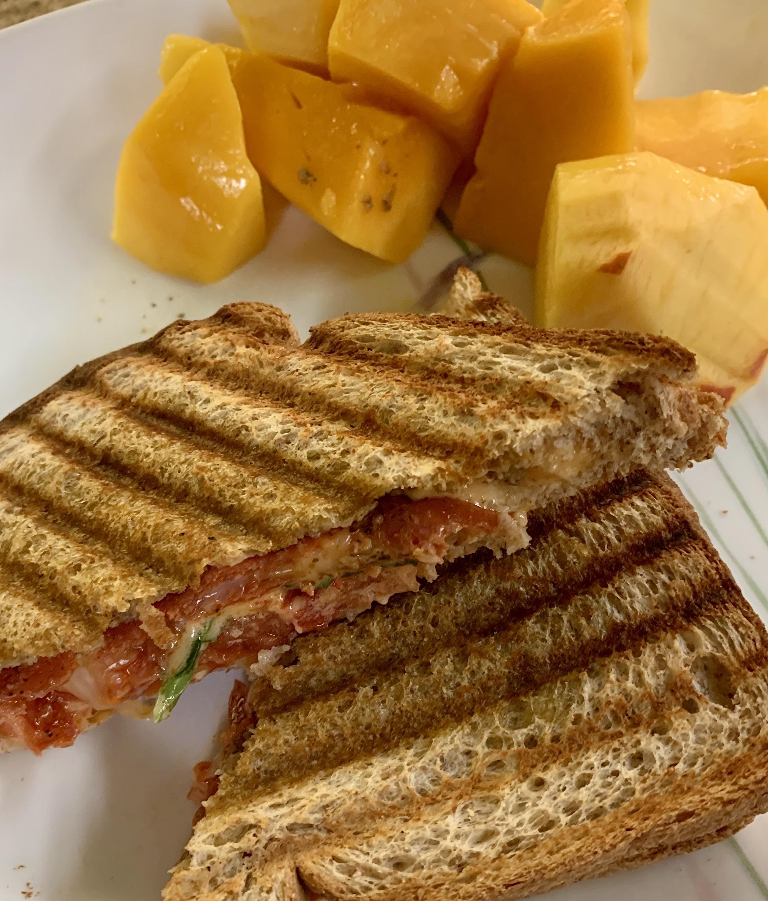 Salami, basil and cheese panini with fruit (350 calories) r/1200isplenty