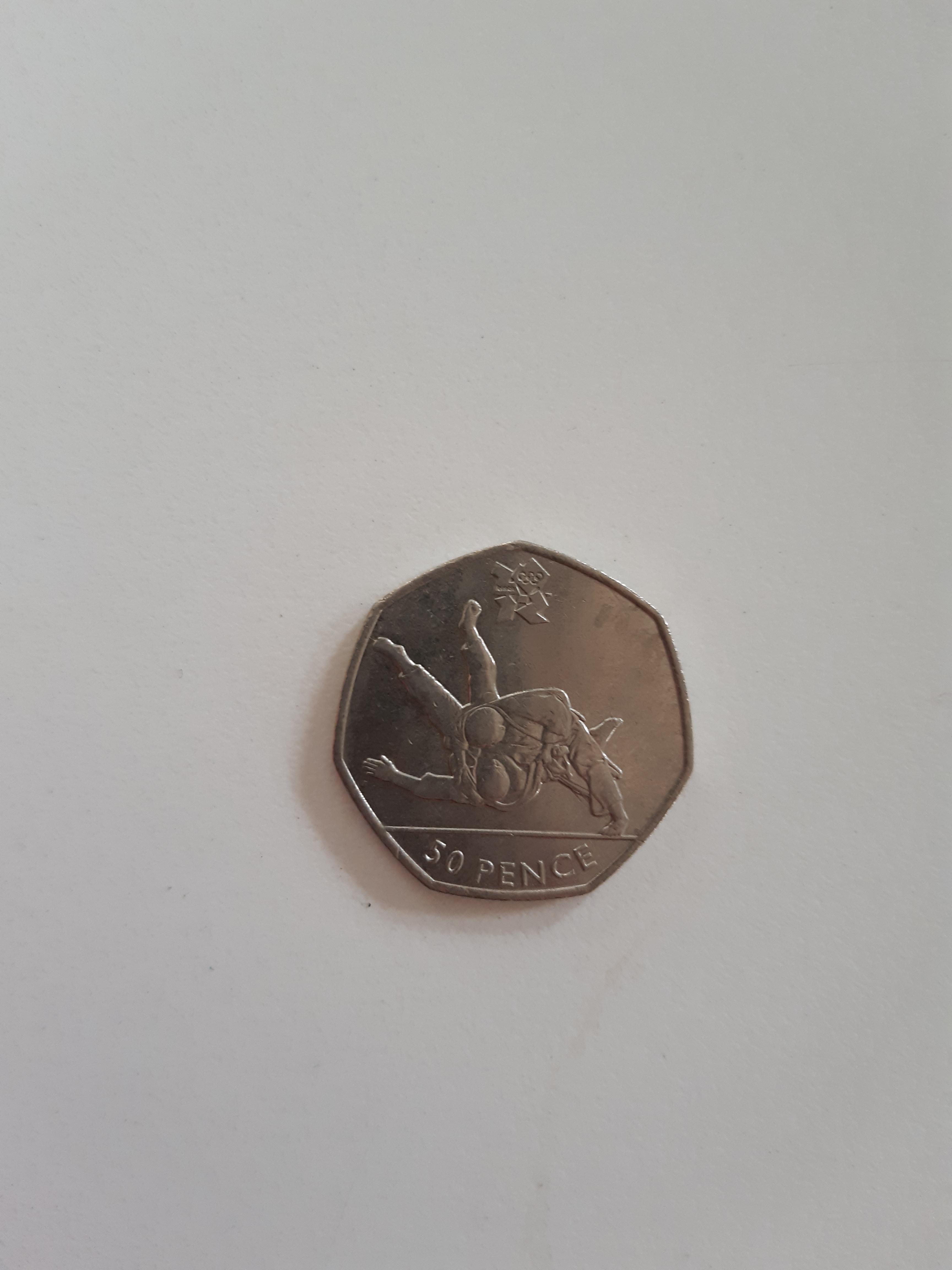 This cool judo 50p coin I found in my change the other day. r/judo