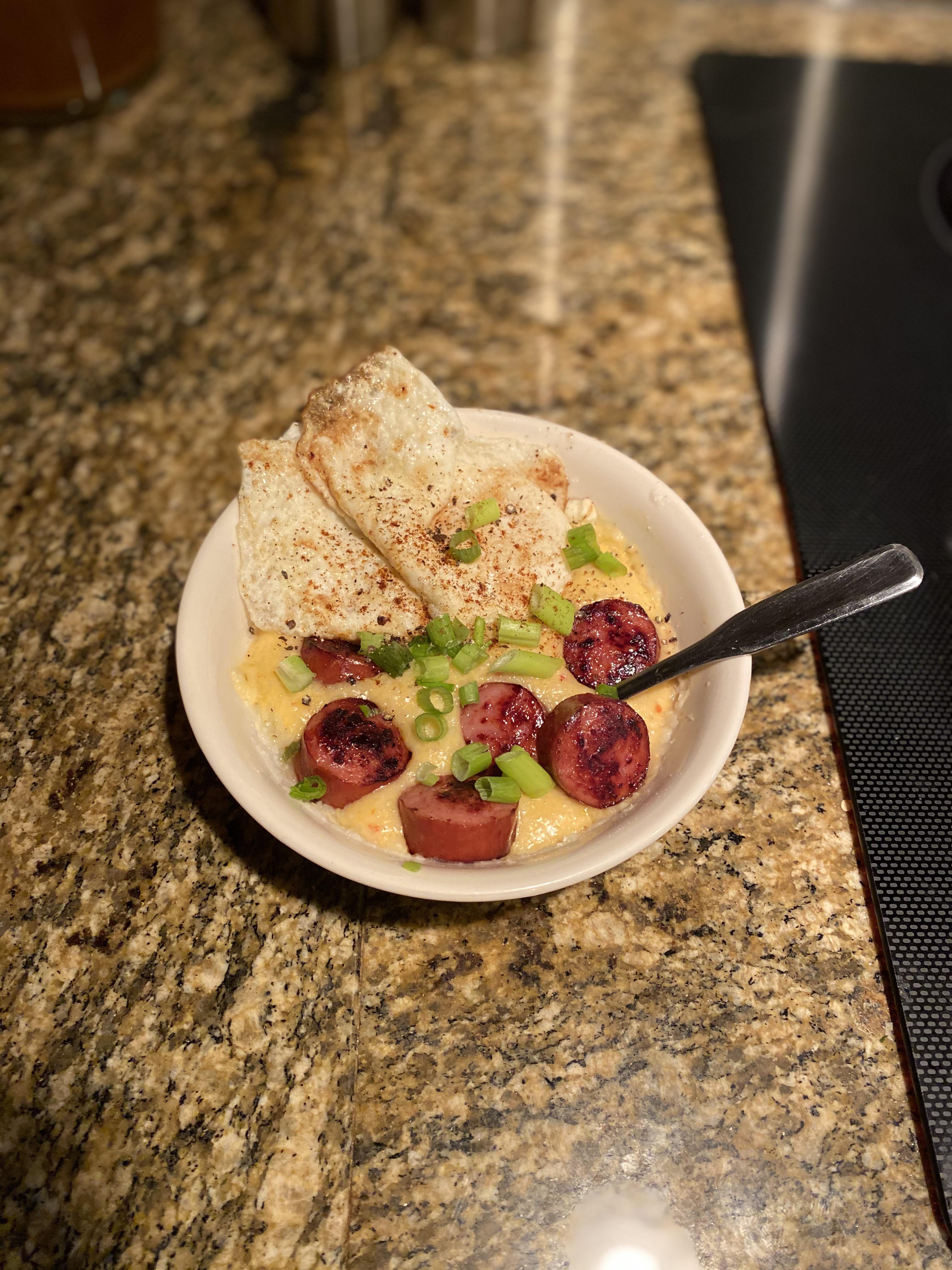 I put 2 on it, jalapeño cheddar grits, kielbasa, green onions. r/PutAnEggOnIt