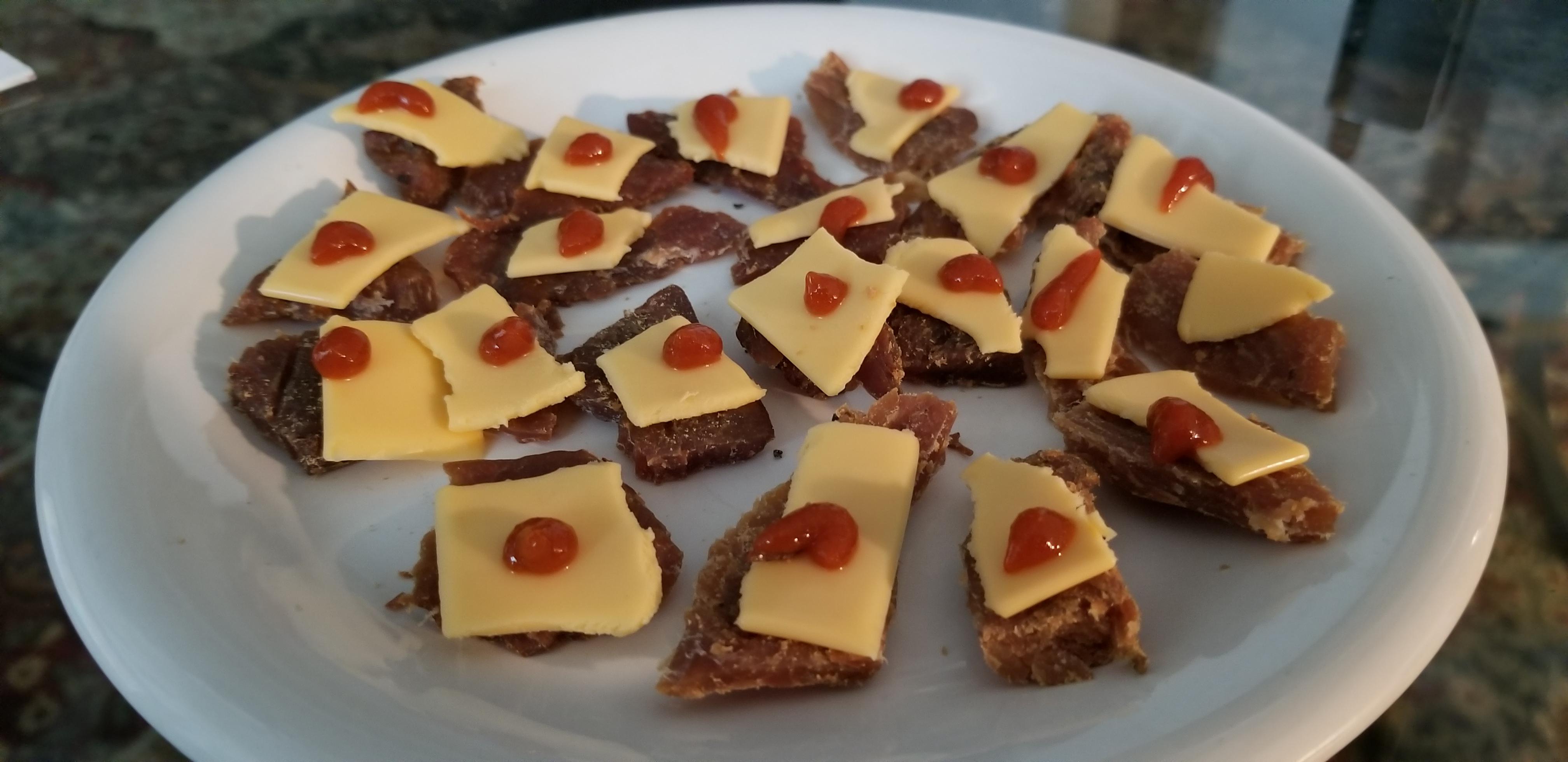8 inch plate turkey jerky, appropriated kraft single, and sriracha drops r/shittyfoodporn