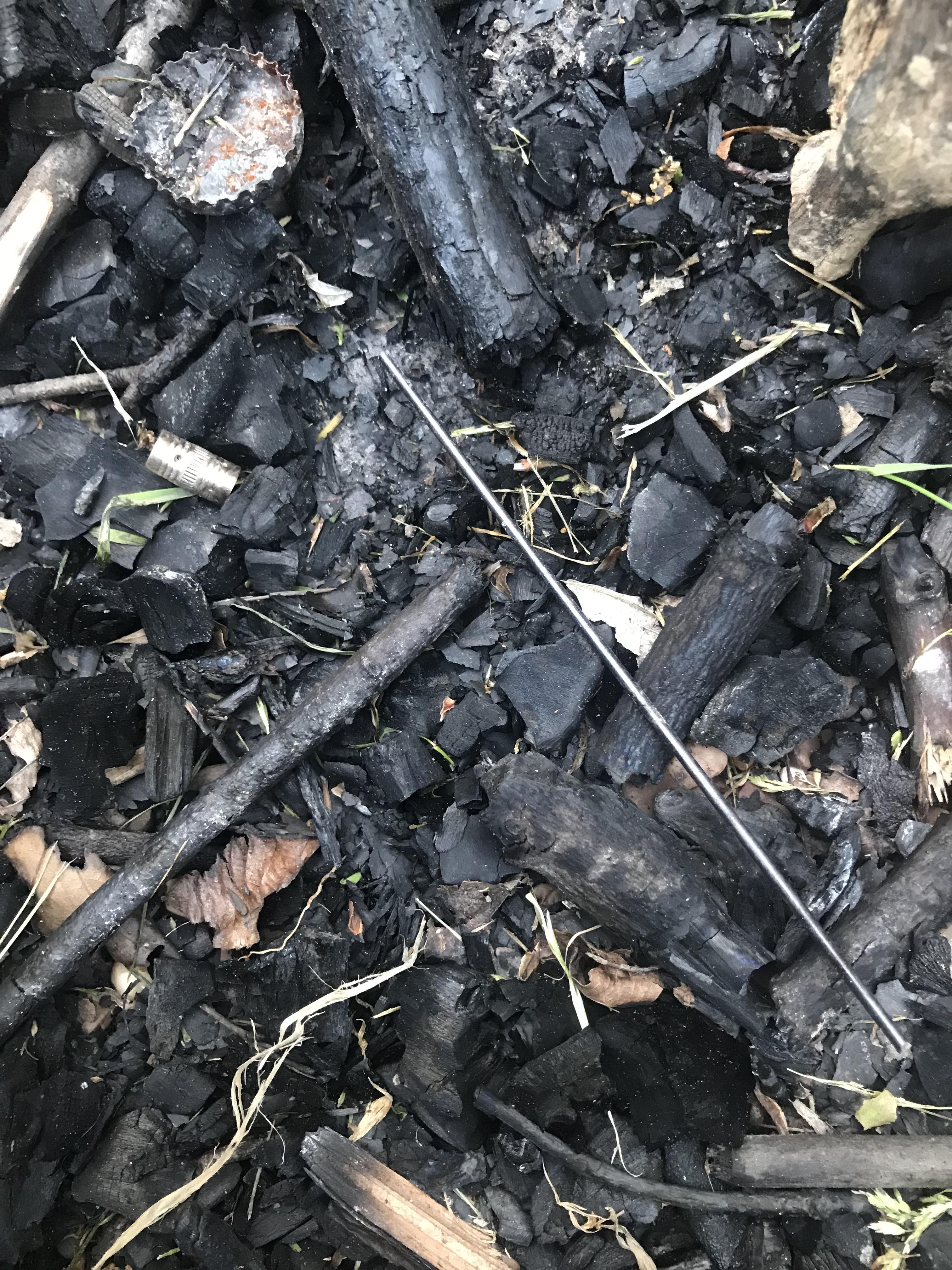 Throwing a pencil in a burning fire pit leaves behind its perfectly