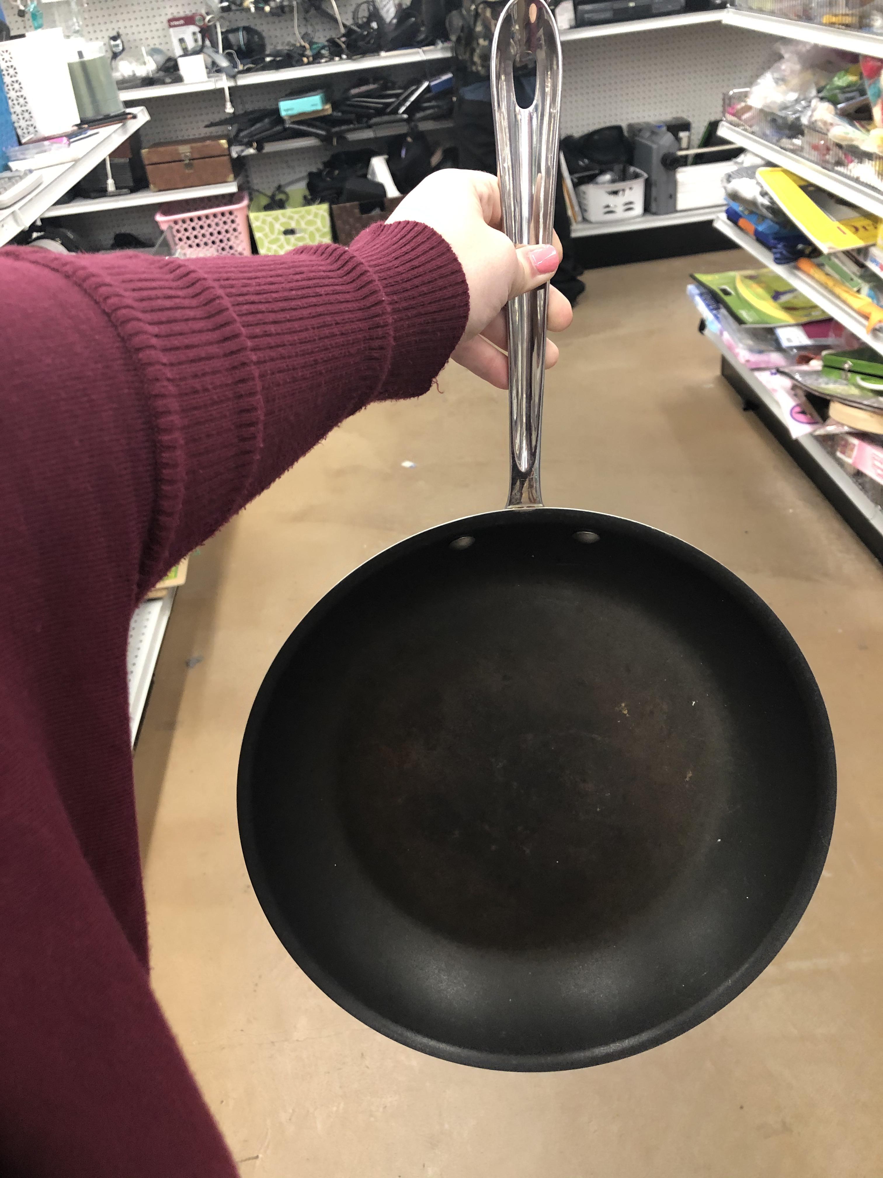 Has anyone ever removed the non stick finish from an all clad pan? The