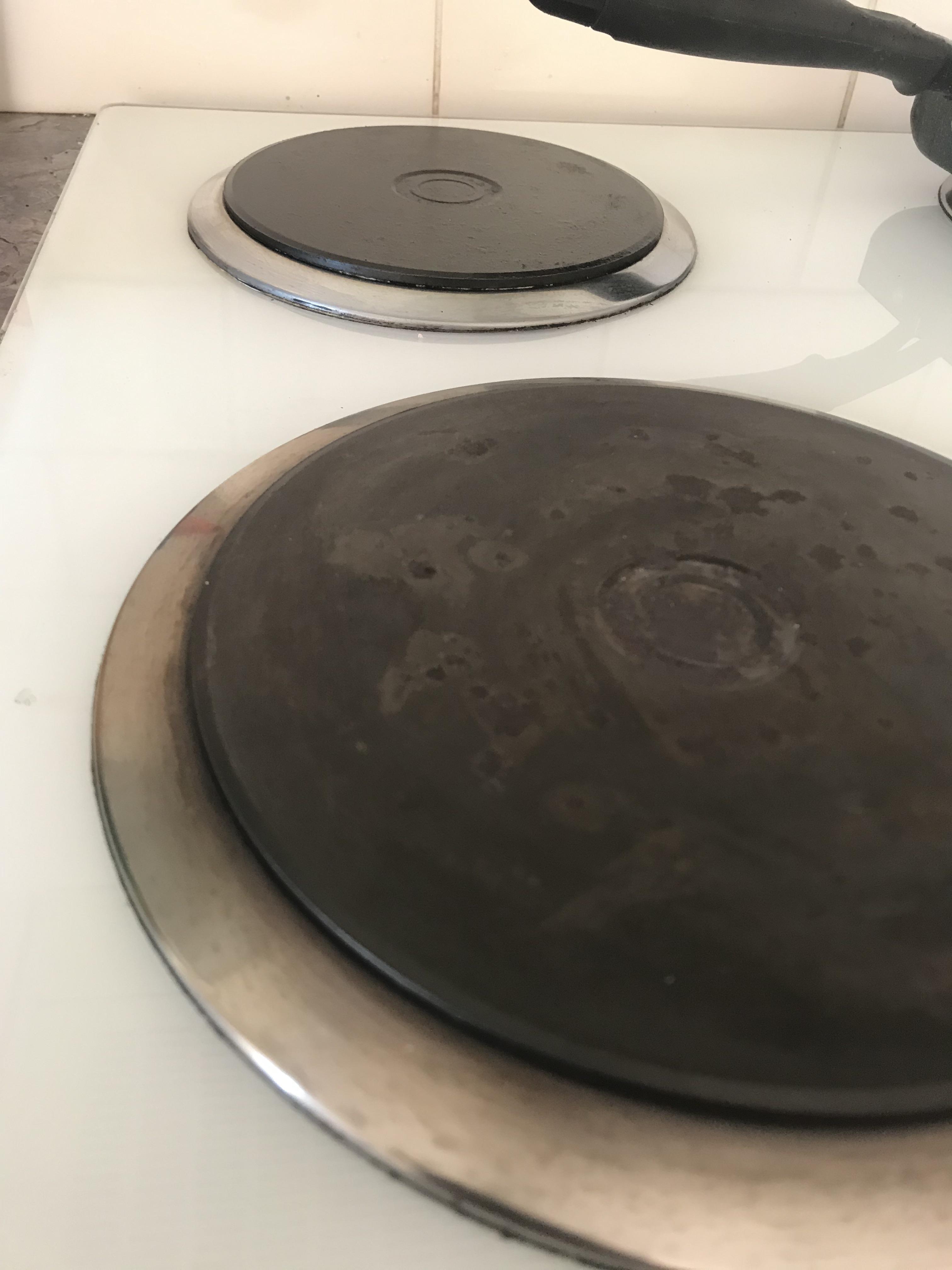 The metal rings on the stove got burnt, what can I do to make it like