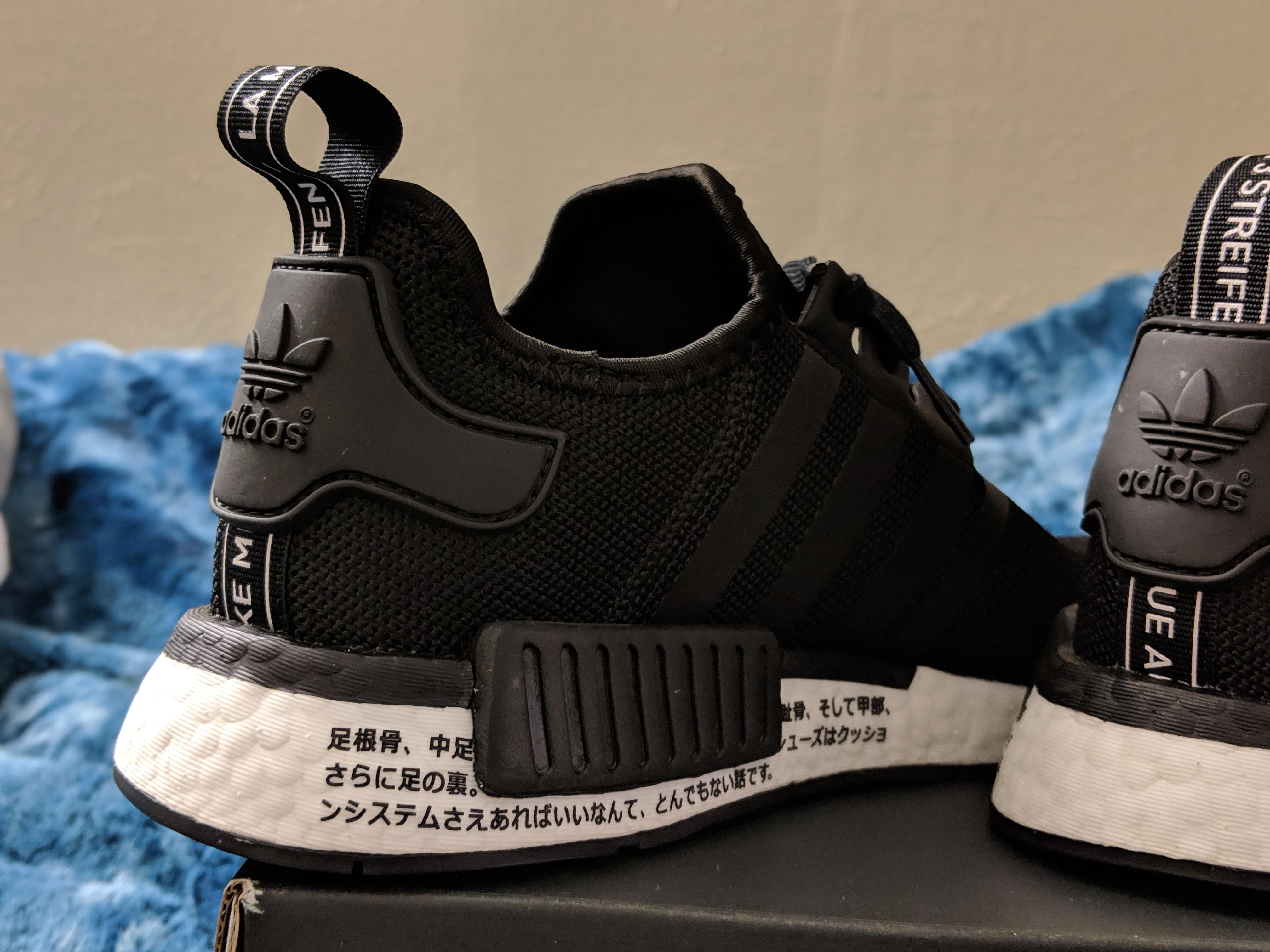 Anyone know what the Japanese writing says on my new nmd r1 japan? r