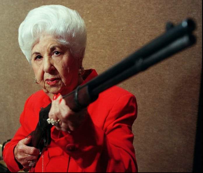 Marie Barrow, Sister of outlaw Clyde Barrow, holding her late brothers