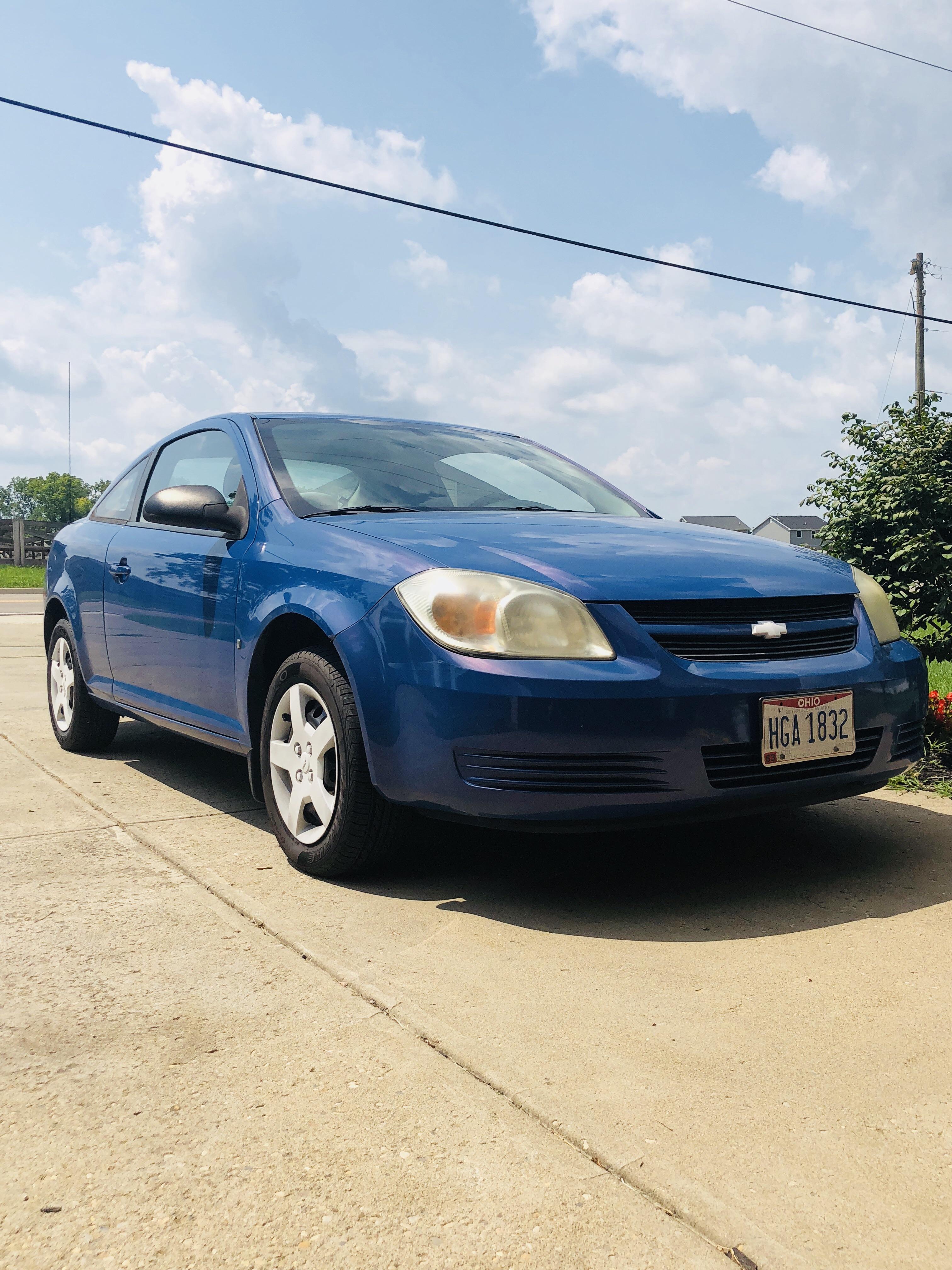 Dipped my Chevy Cobalt wheel covers white, next step is a white stripe