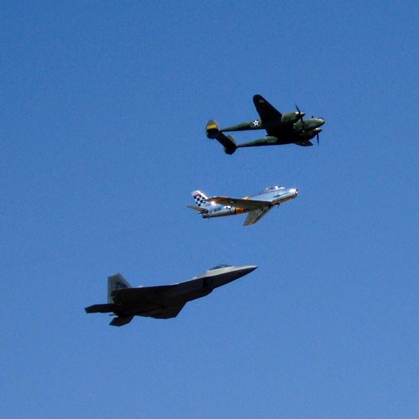 Heritage Flight at the OshKosh, WI Air Show P38, F86, and F22. r