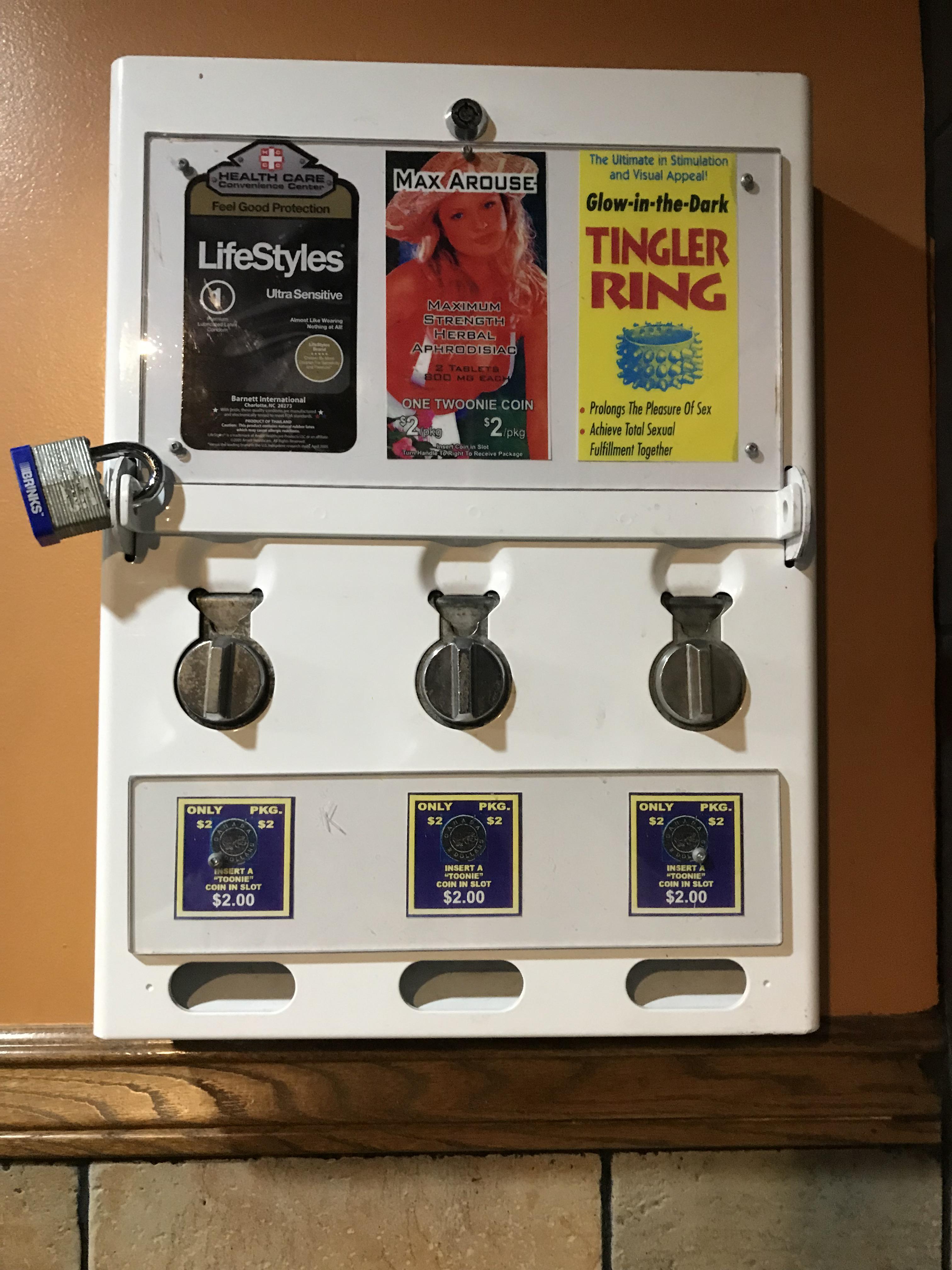 Condom dispenser in pub bathroom. r/mildlyinteresting