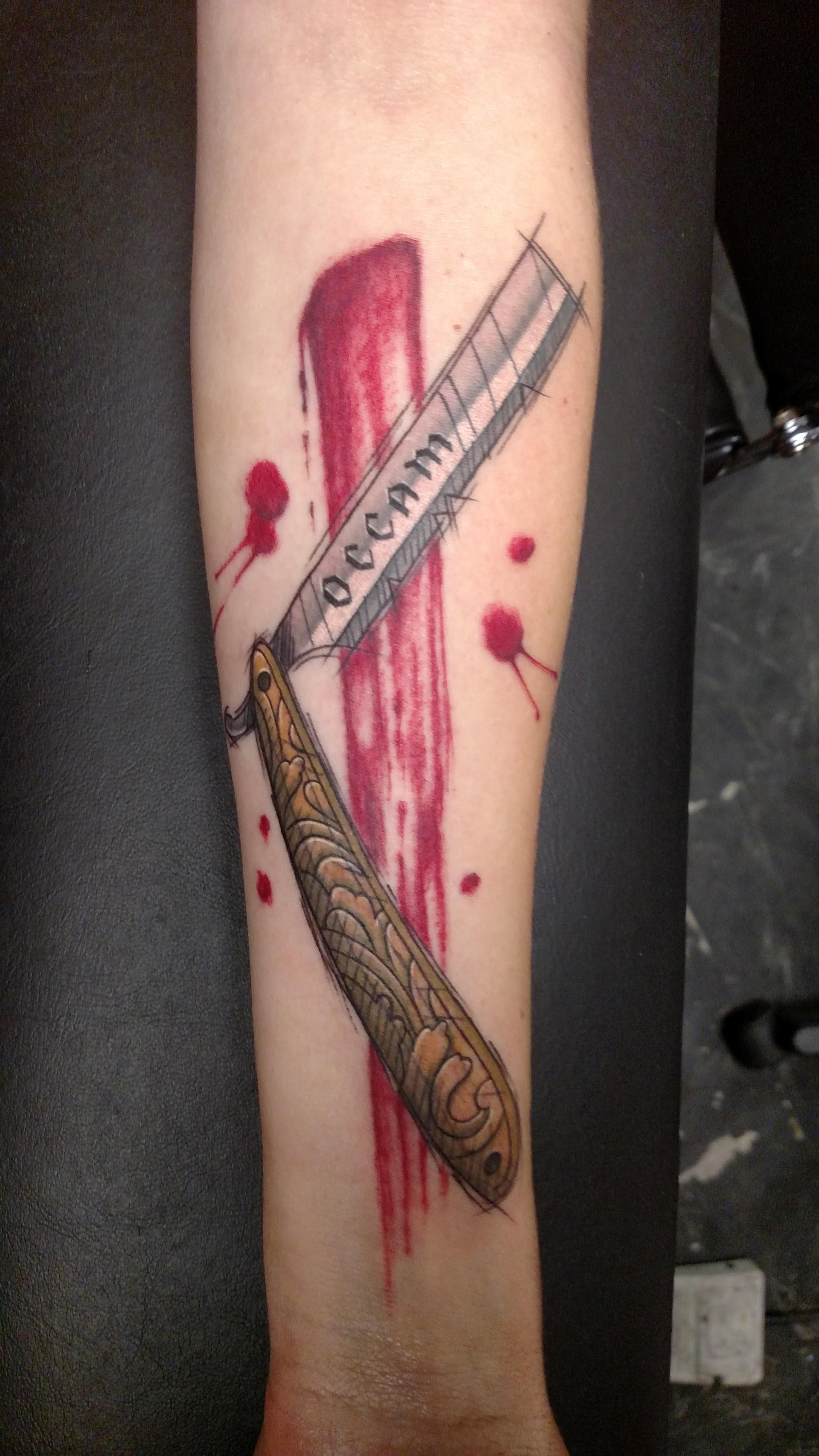 Occam's razor by Dr Z at Laughing Hyena Tattoos in Washington, DC tattoos