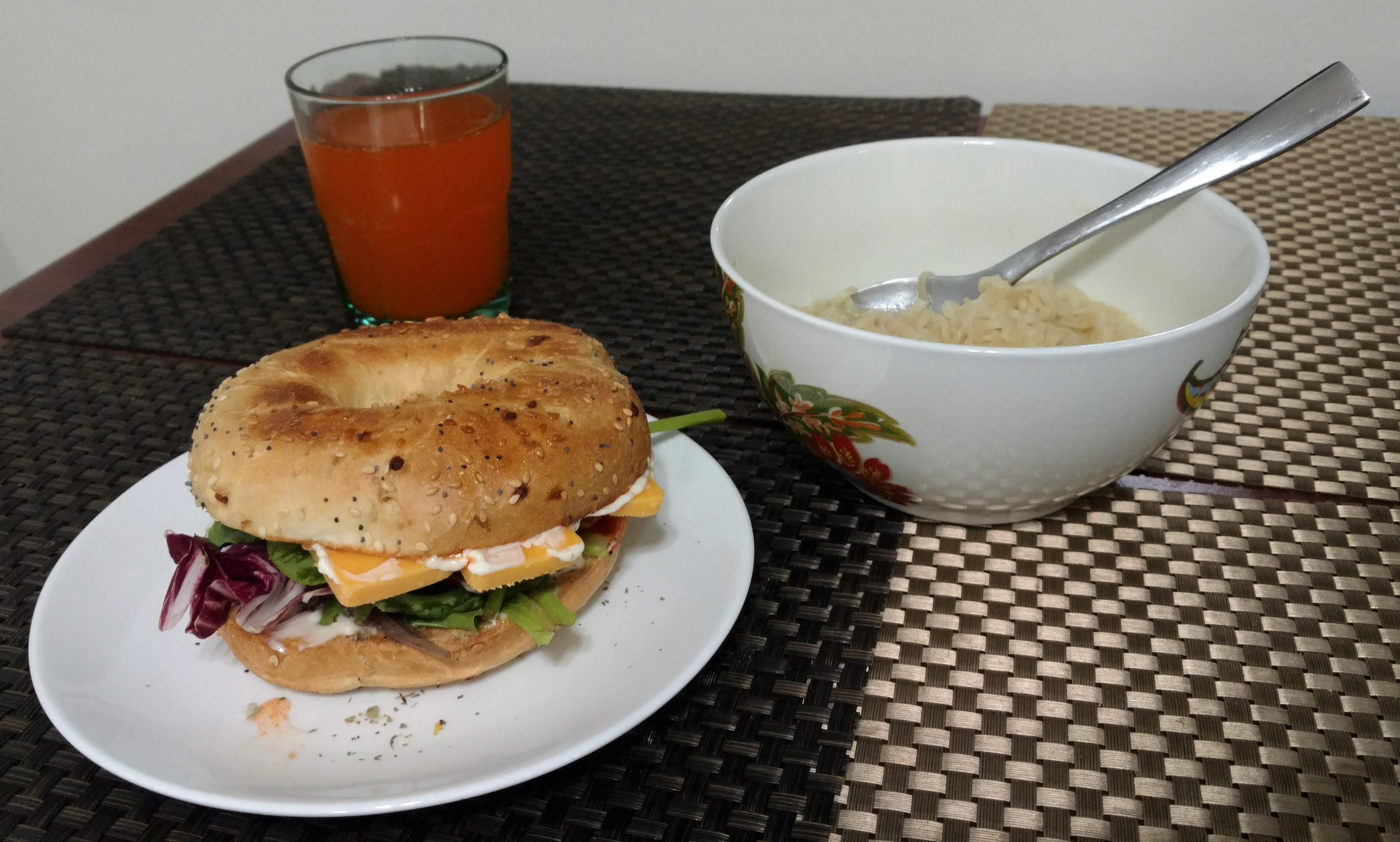 Cheddar cheese sandwich on an everything bagel, creamy chicken ramen noodles, and orange soda