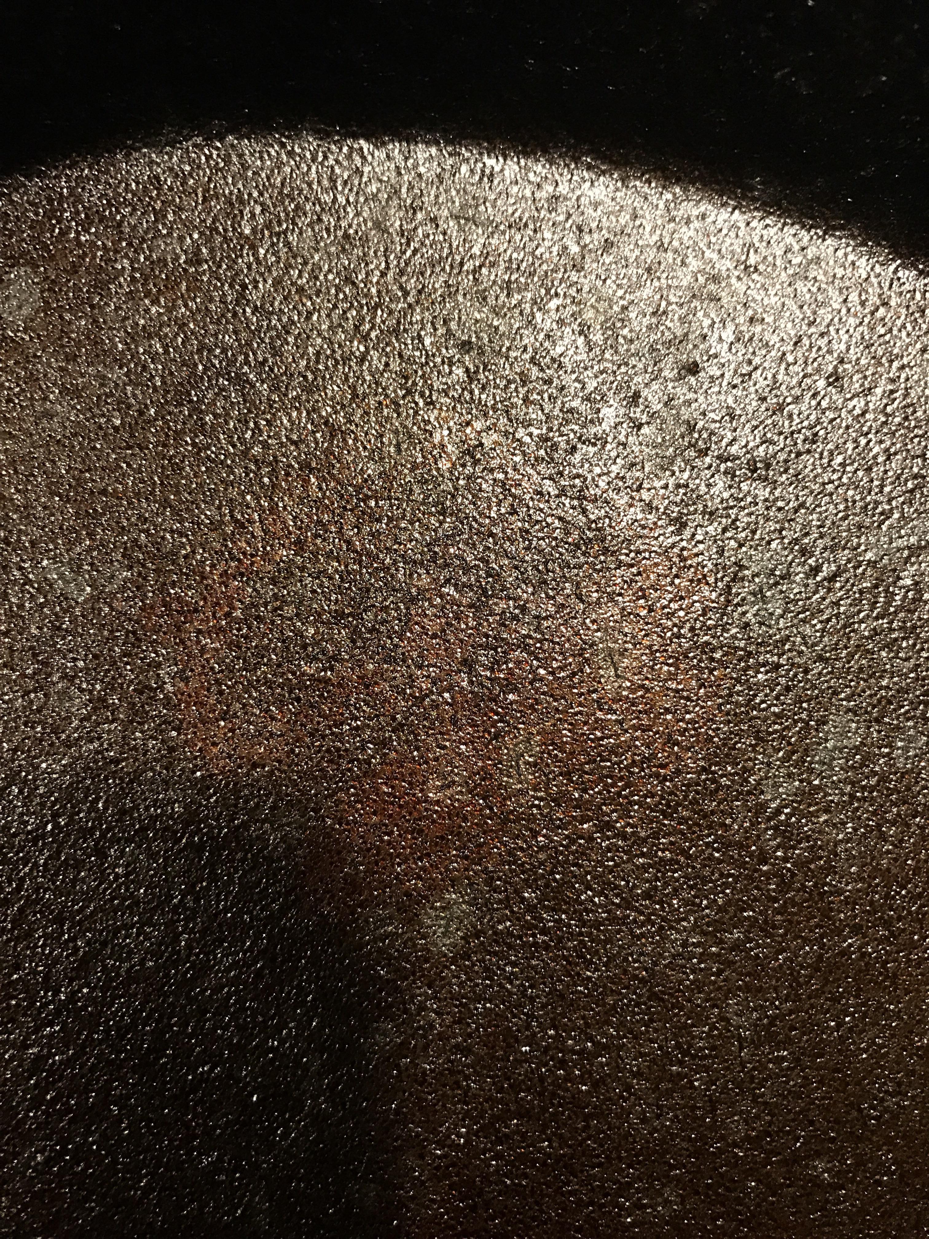 I bought a brand new cast iron skillet and it had a weird brown spot