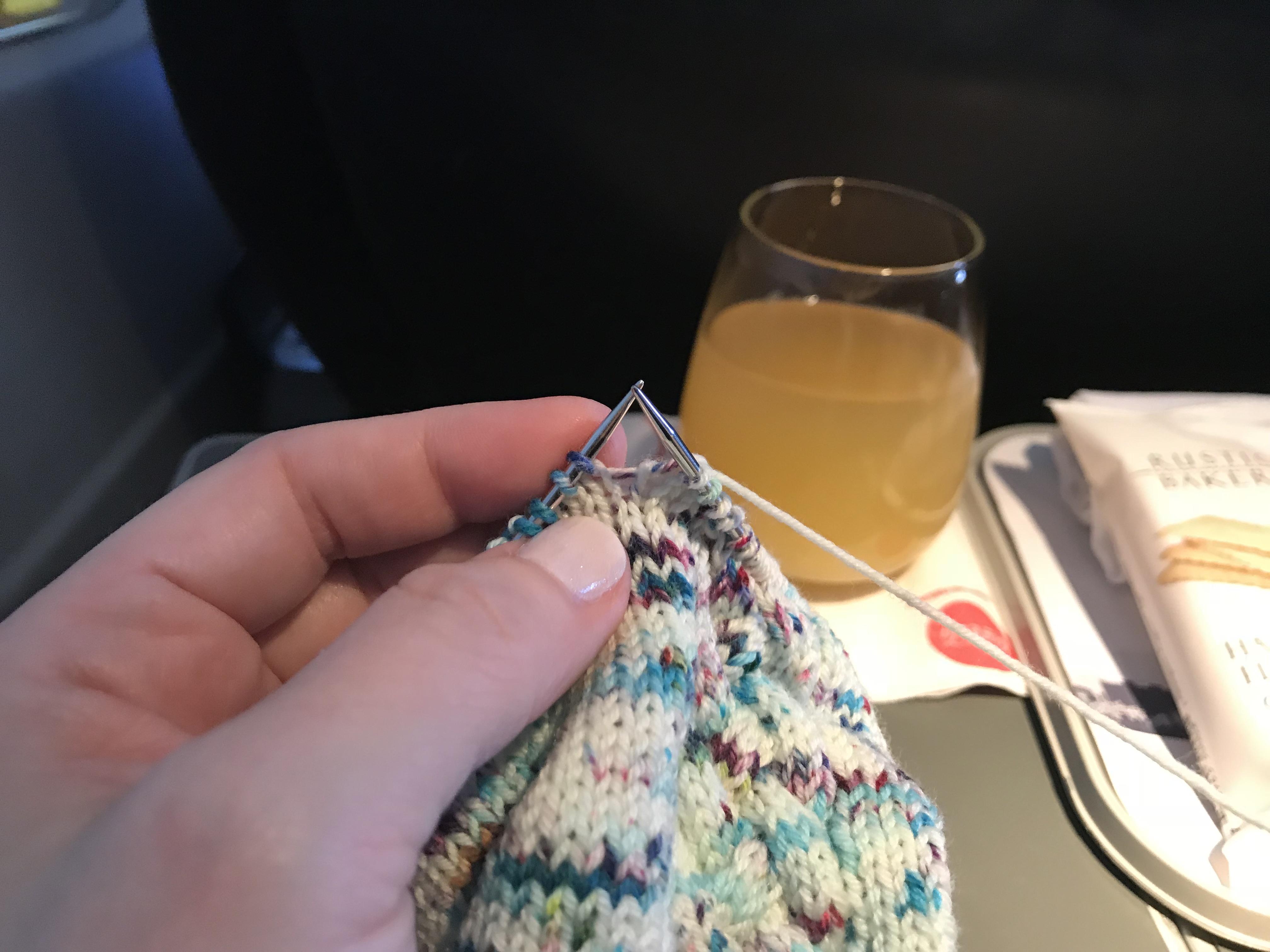 Socks and mimosas on a plane r/Drunkknitting