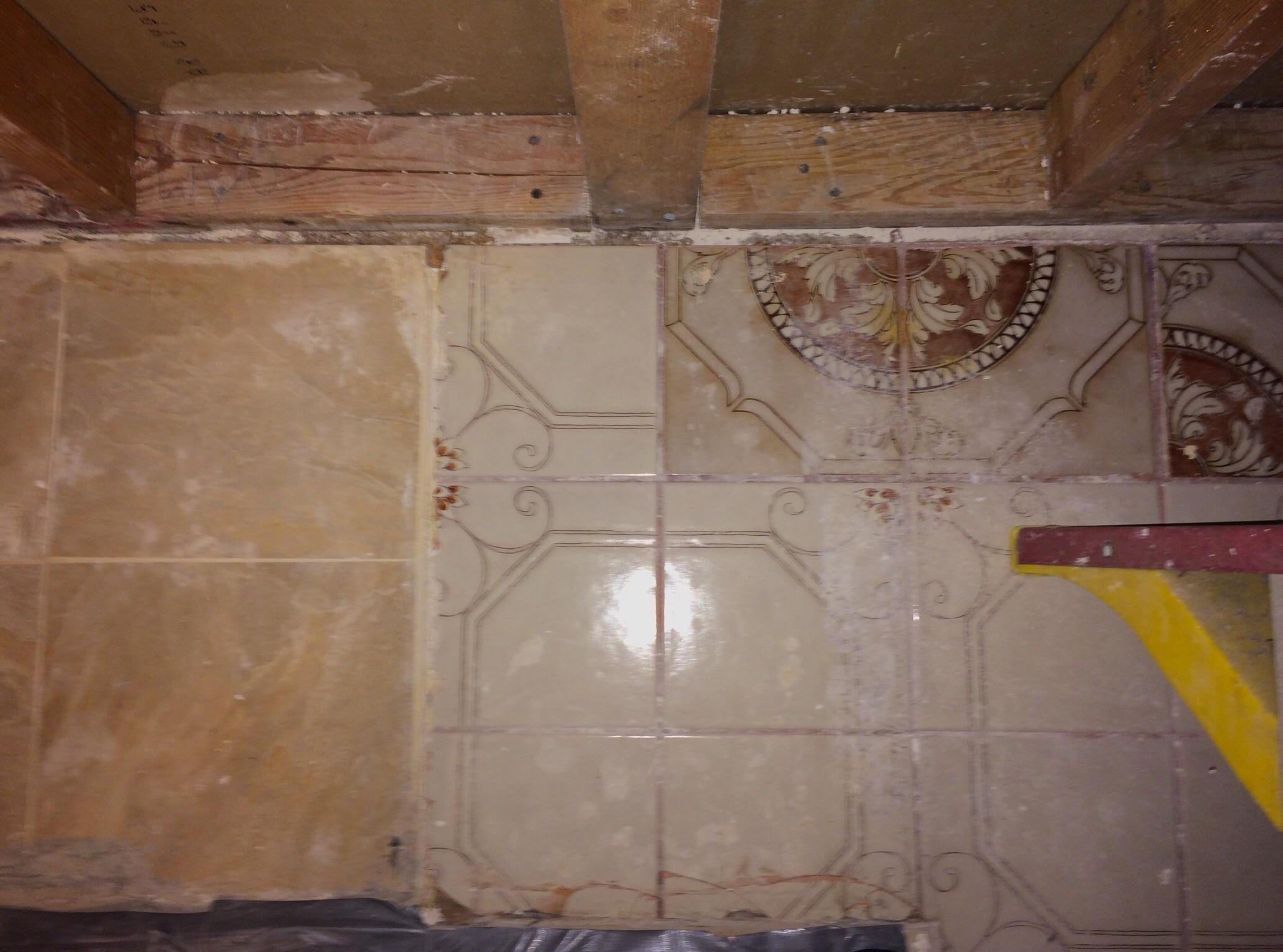 Three generations of tile found under the dishwasher in my San