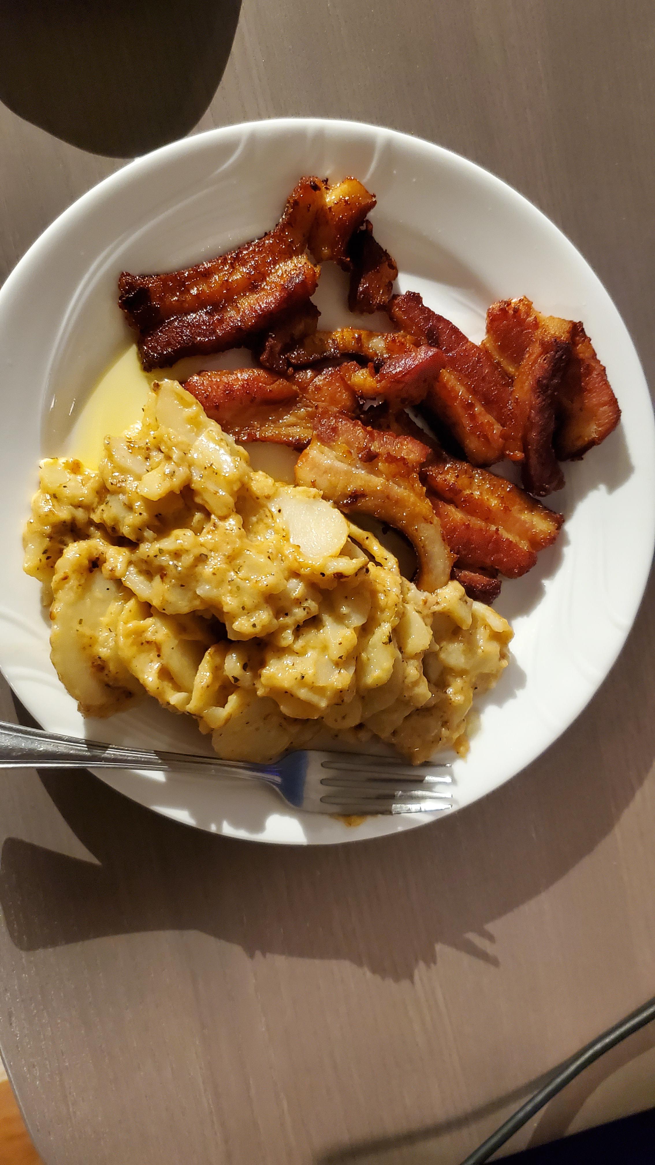 Overcooked Costco pork belly with frozen Costco scalloped potatoes