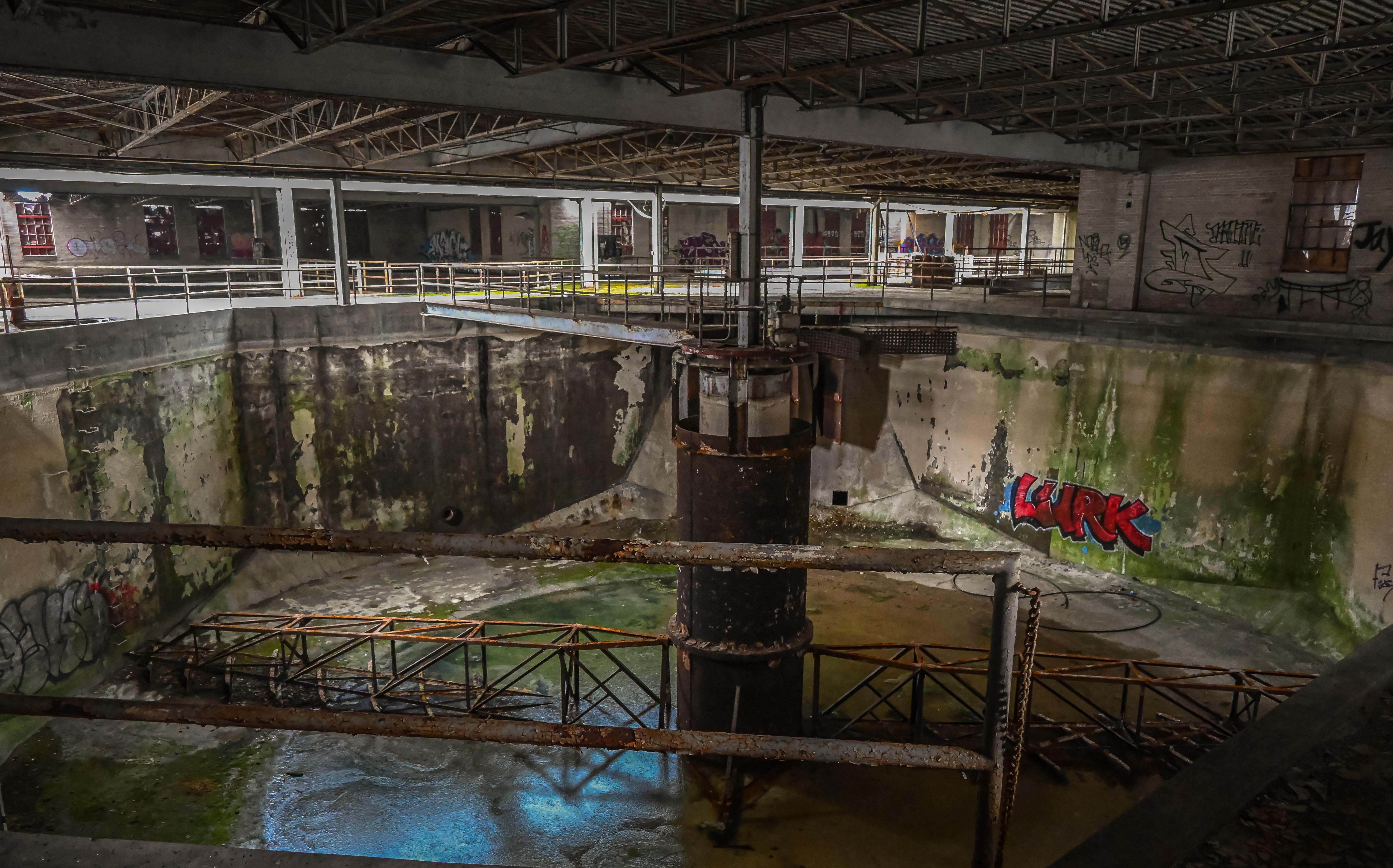 An abandoned water treatment plants main tank! r/AbandonedPorn
