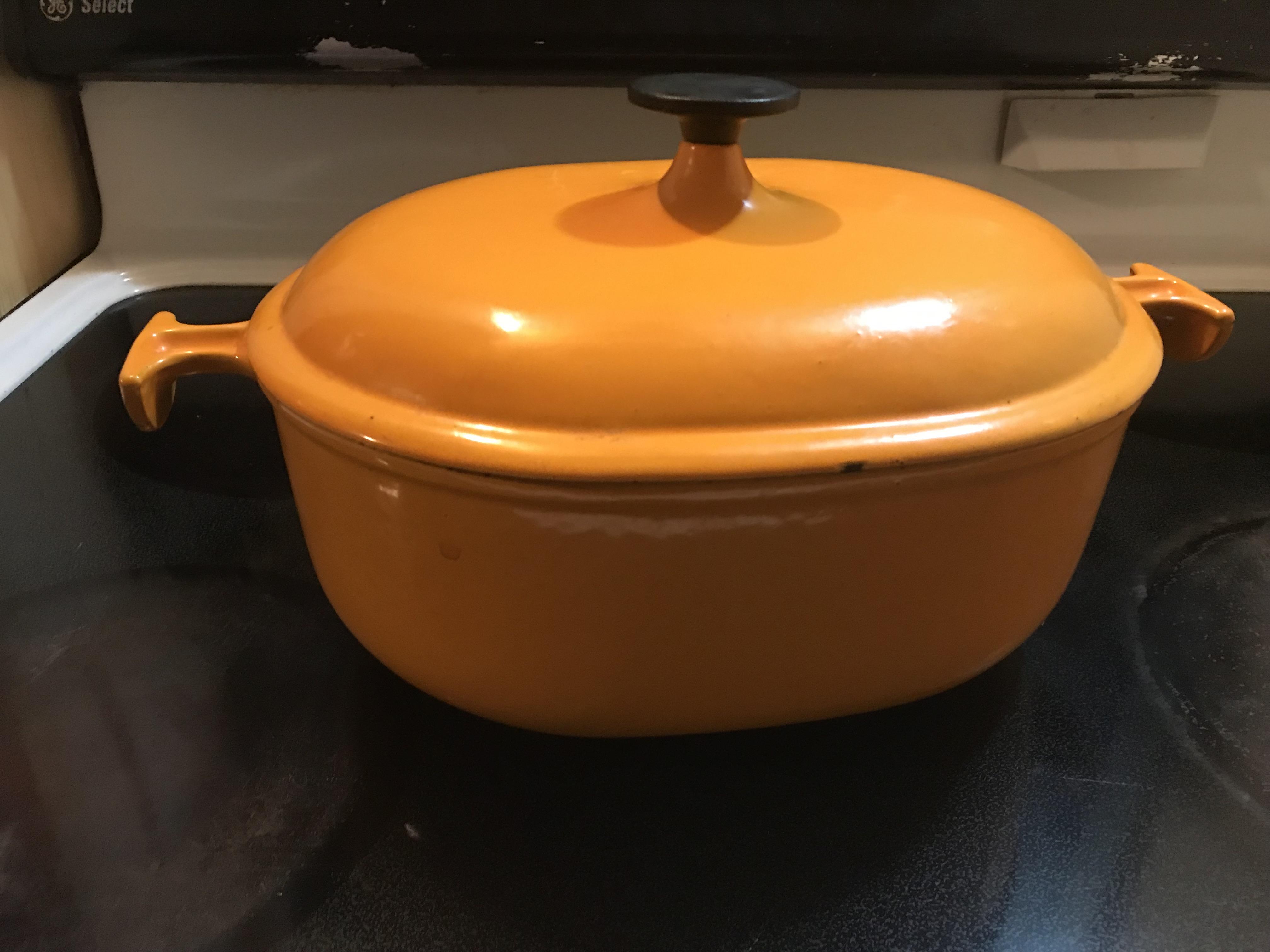 Found this Le Creuset hidden inside a cheap roasting pan on a top shelf