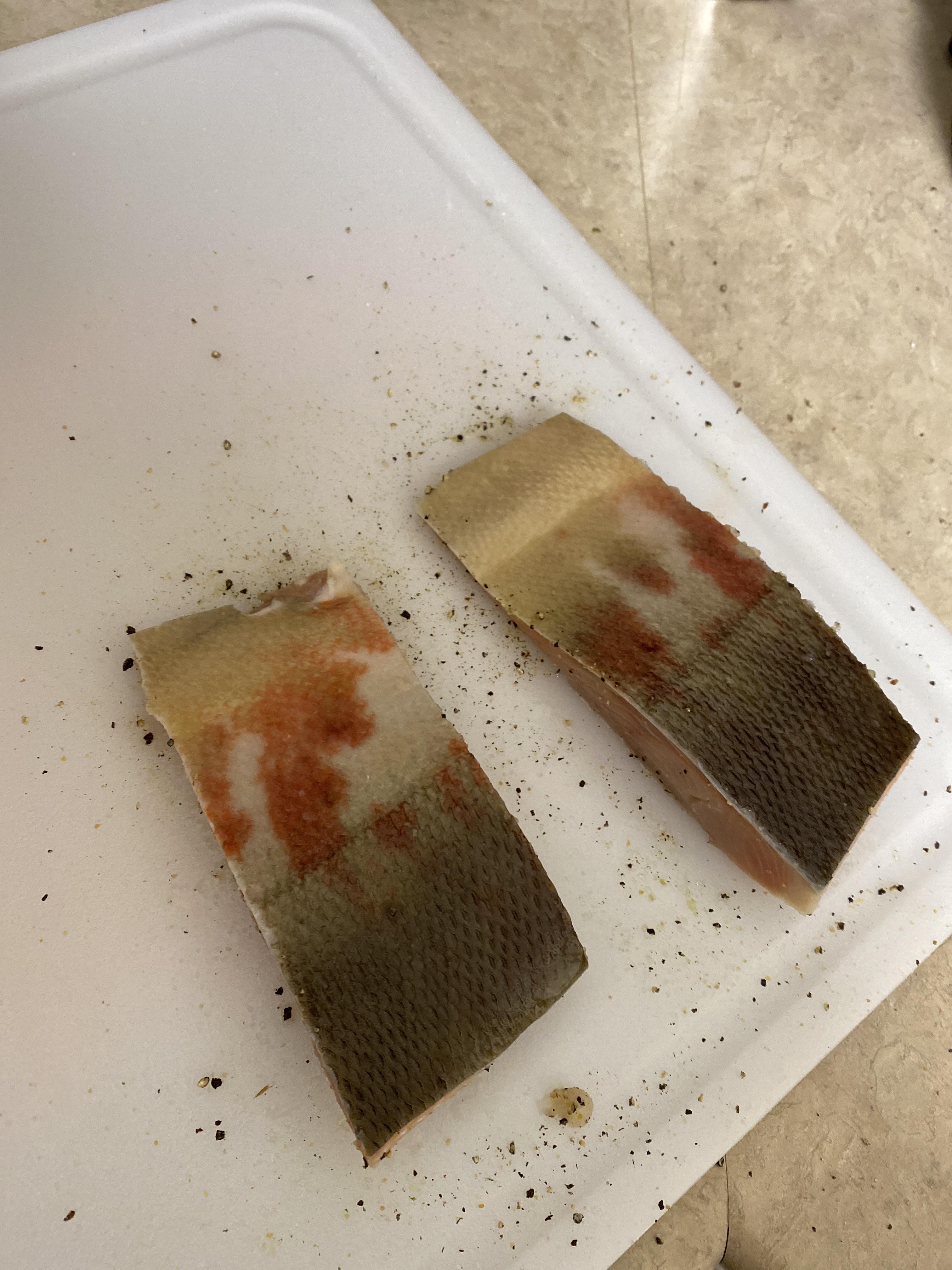 Anyone know what’s up with the red spots on the salmon? Never seen this