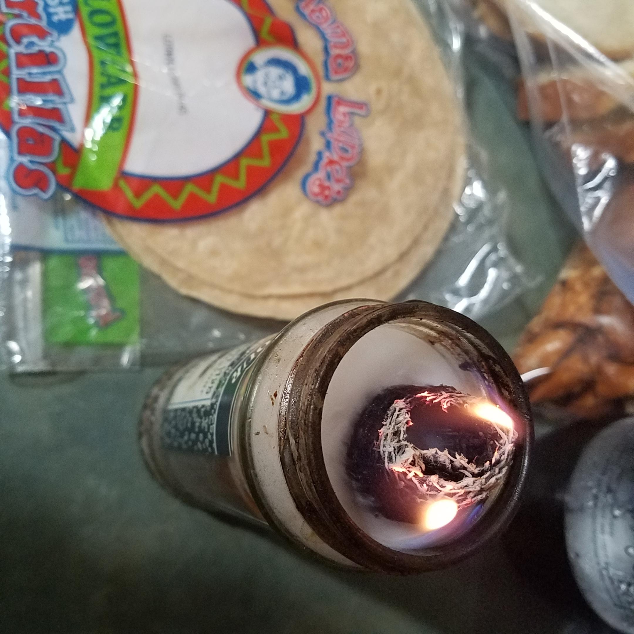 The way this candle is struggling to stay lit as it burns into the