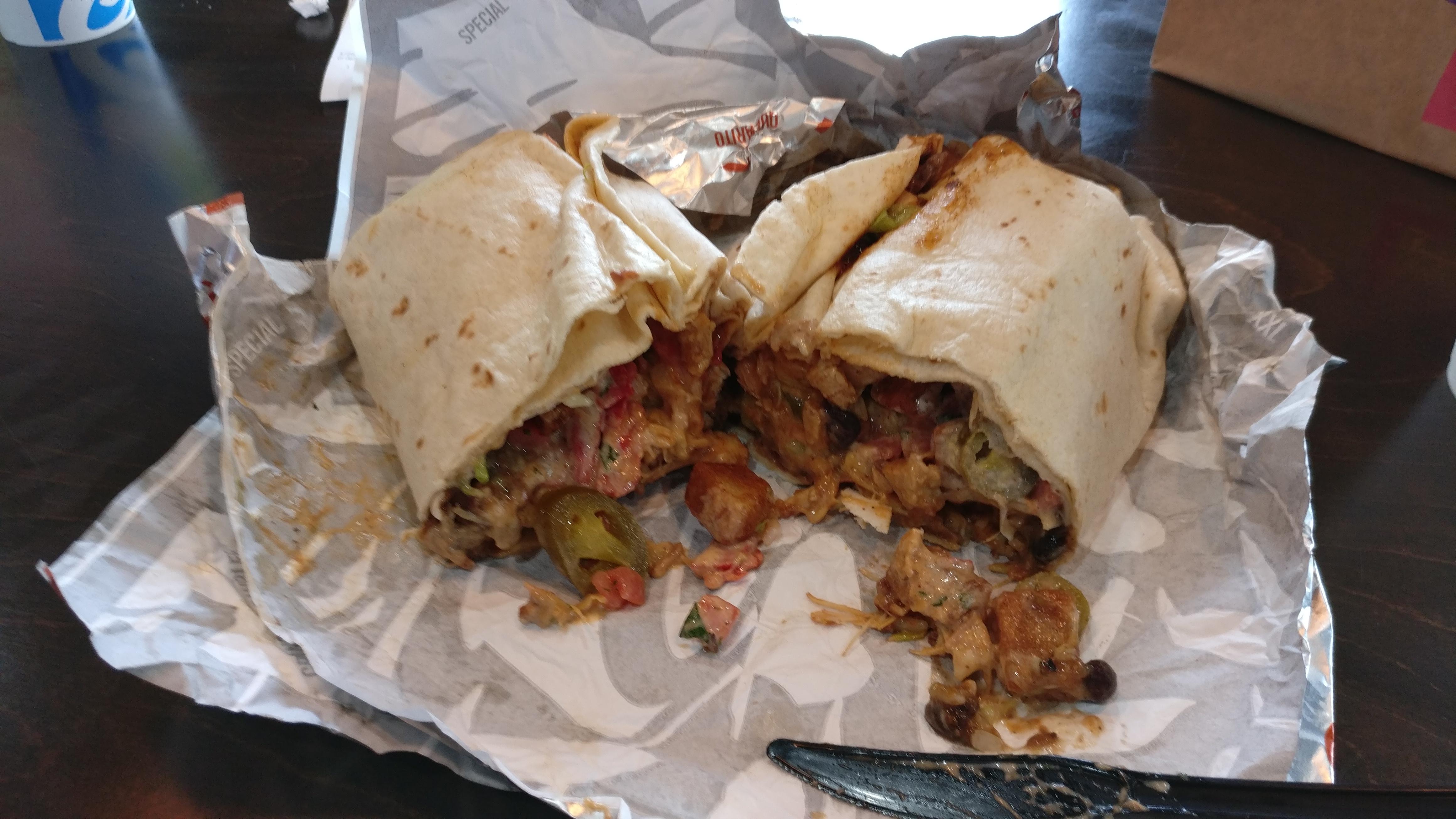 A Taco Bell Triple Melt Burrito (1 Dollar) with everything possible added (13 dollars total) r
