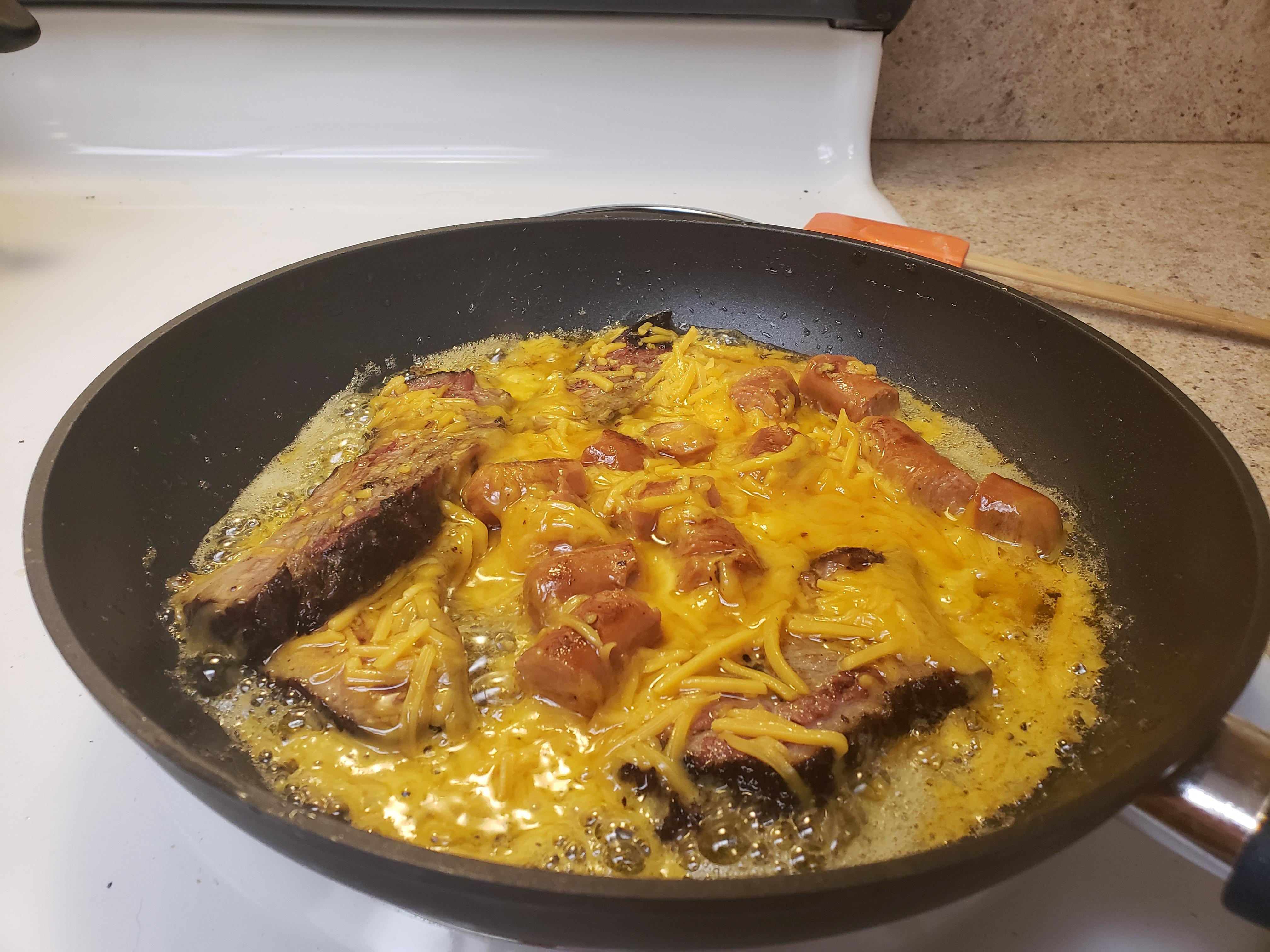 Day old brisket, hot dogs, whole bag of cheddar, fried in bacon grease