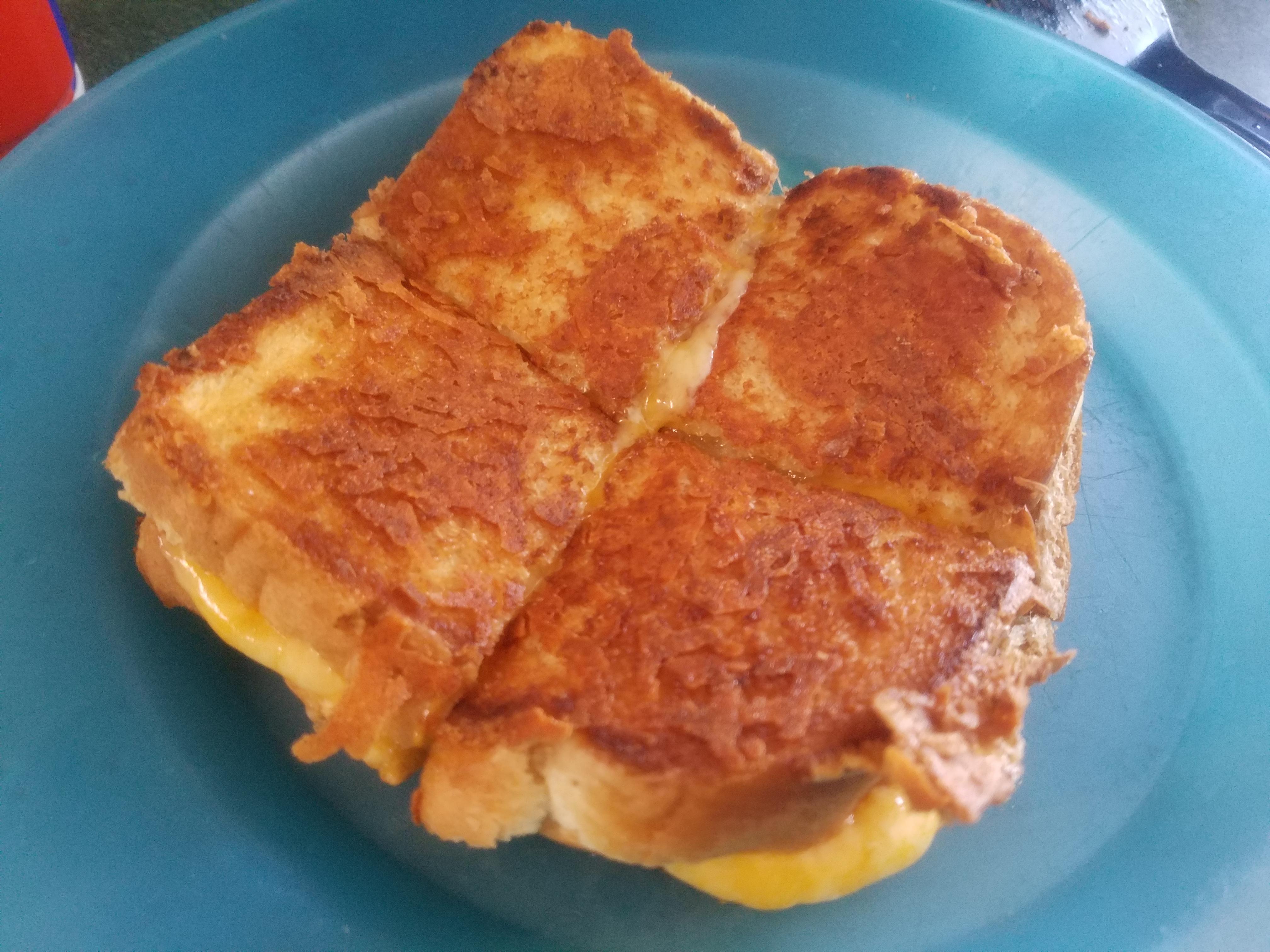 Cheddar and gouda on white. Grilled Cheese Chirps