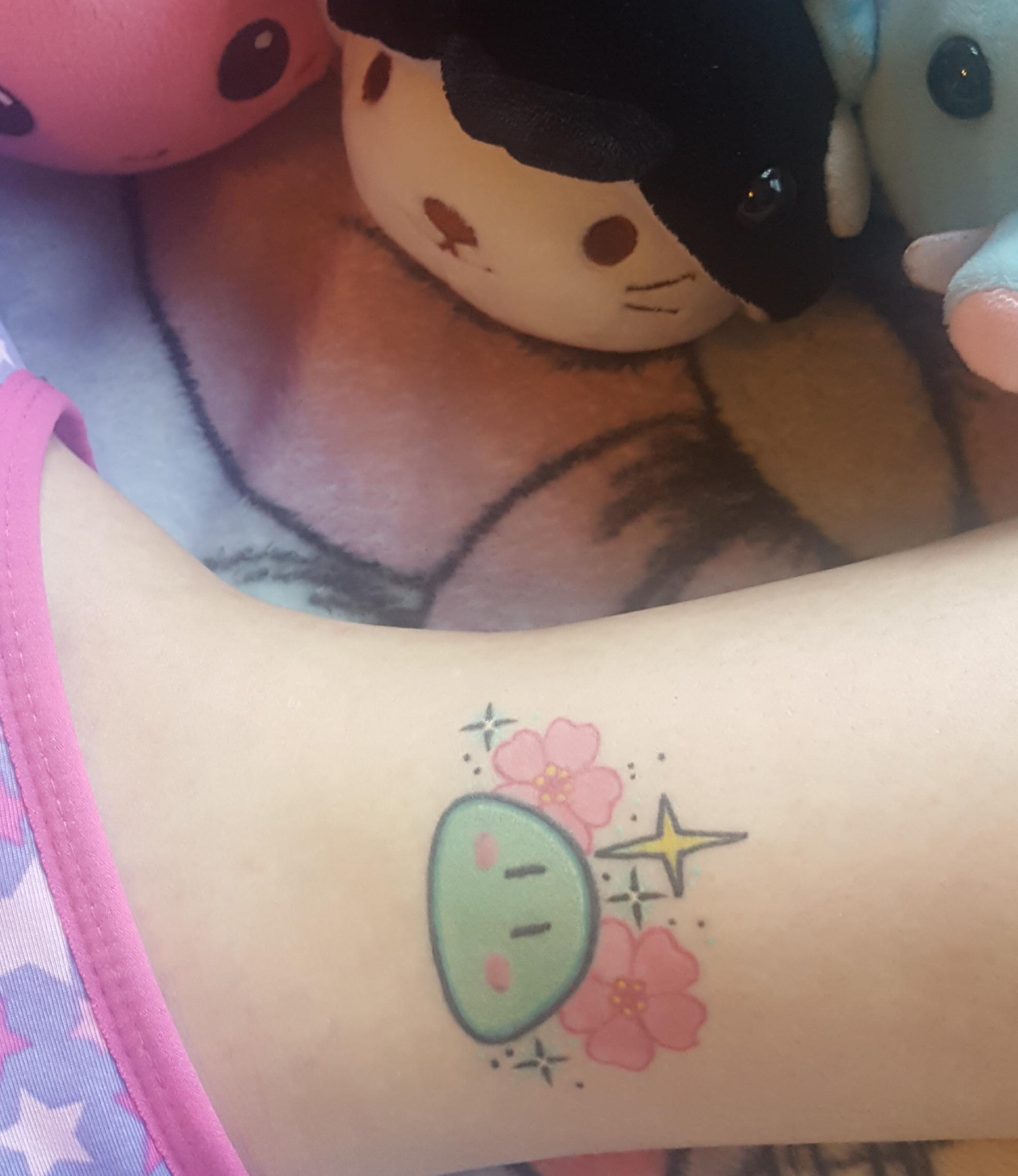 Kawaii style dango and sakura tattoo to represent the anime 'Clannad