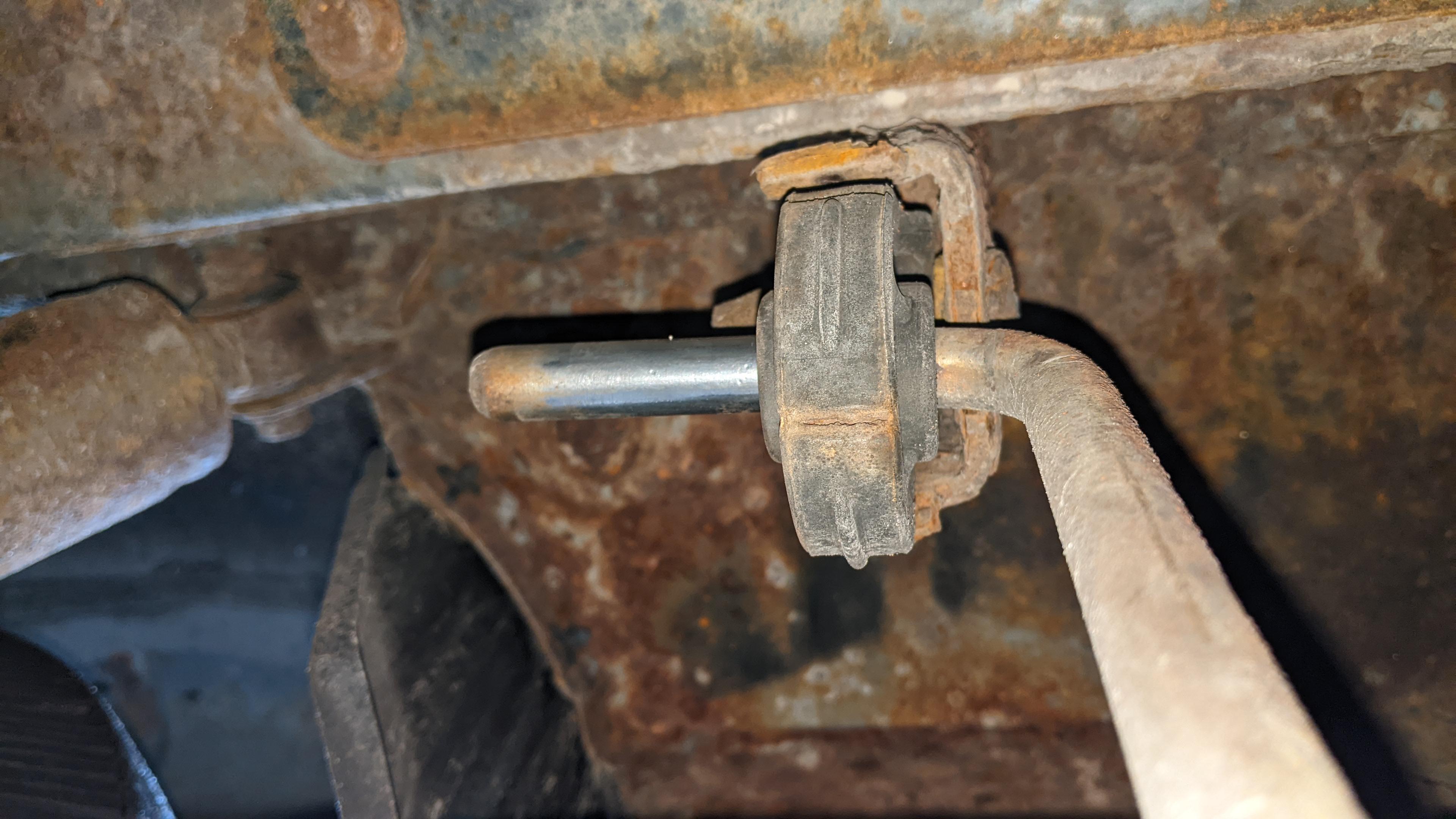 What can I use to stop this muffler hanger from sliding back and forth