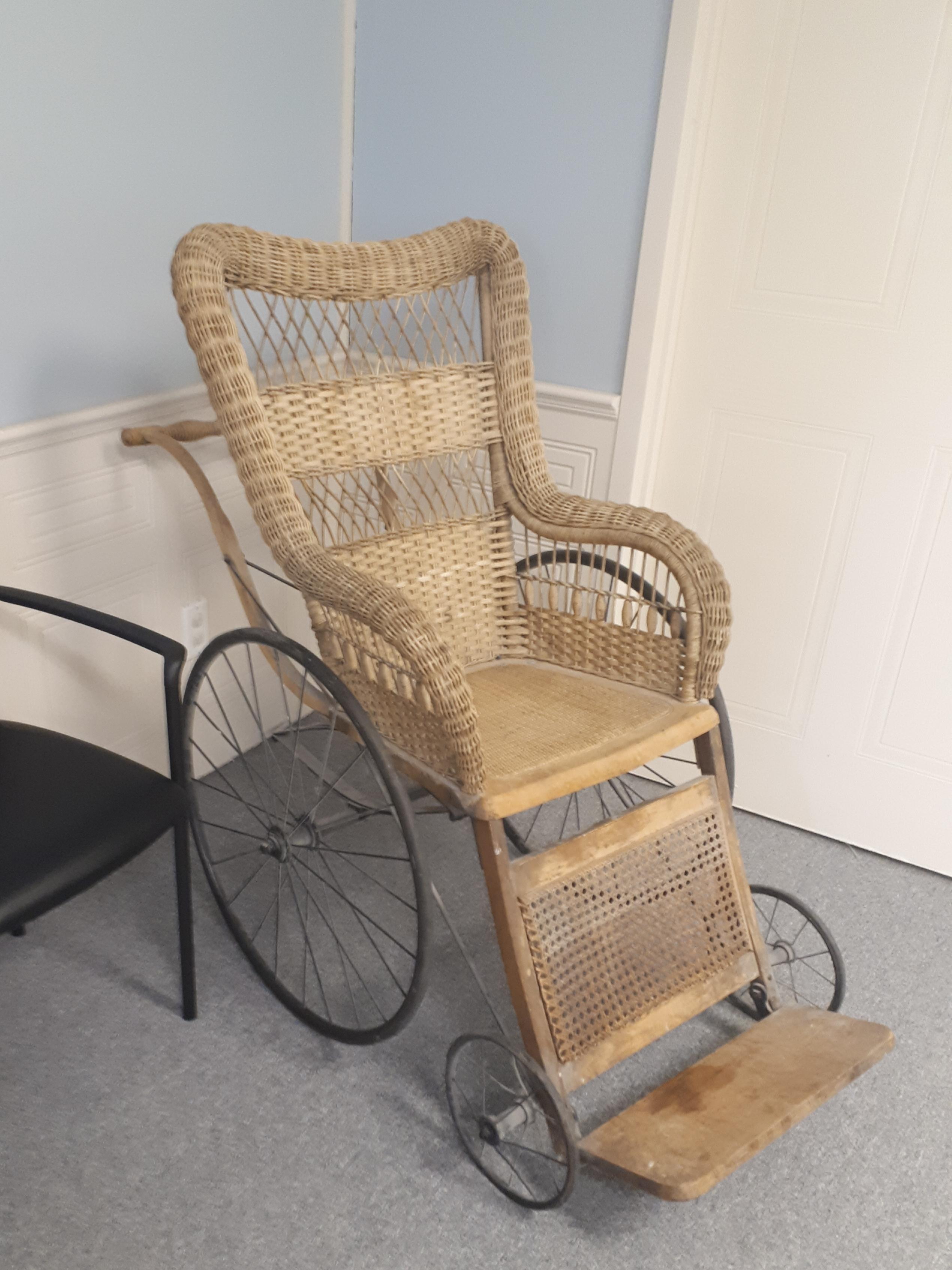This old school wheelchair in an orthotic and brace making office. r