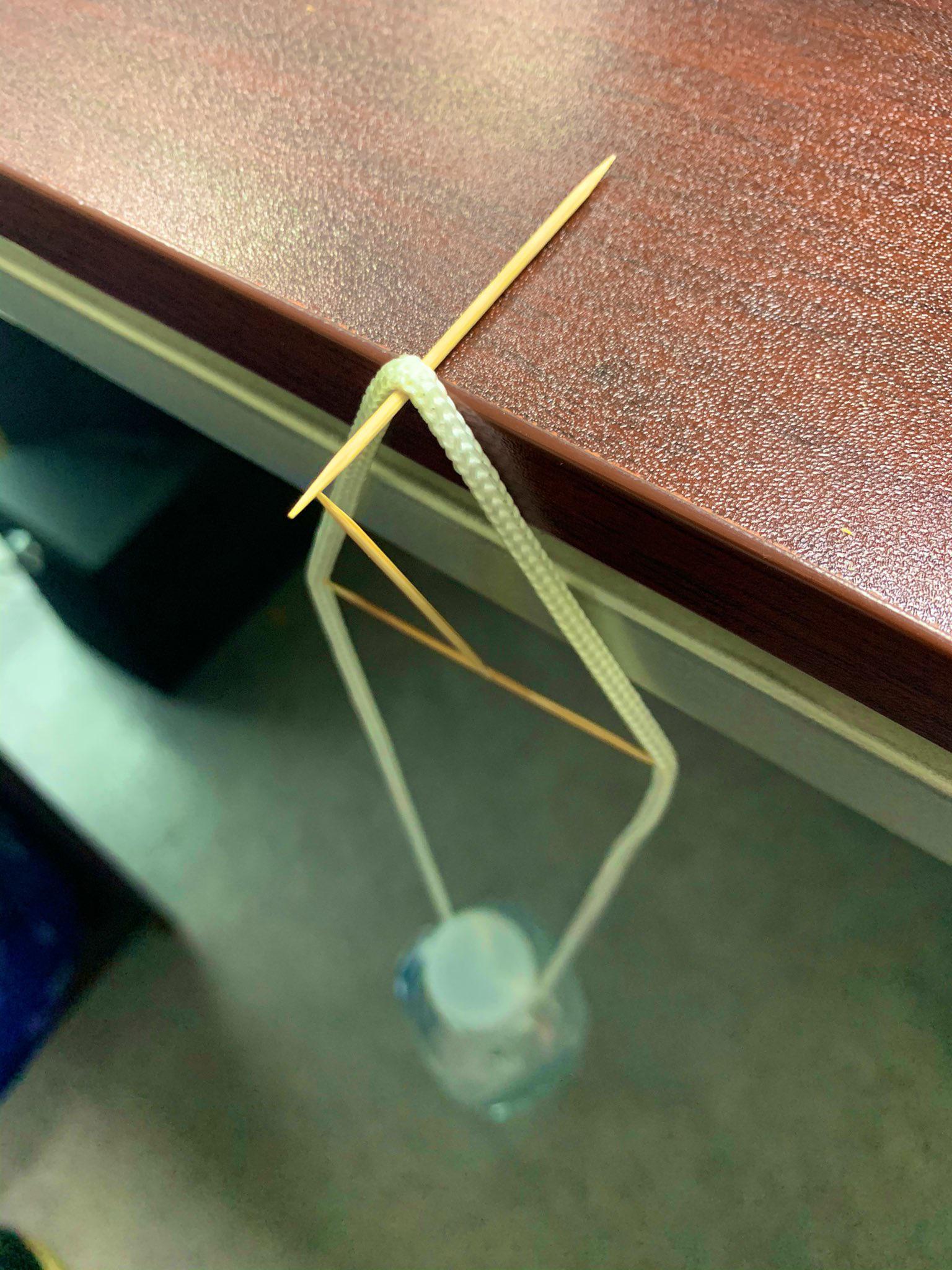 Holding up a waterbottle using 3 toothpicks r/interestingasfuck