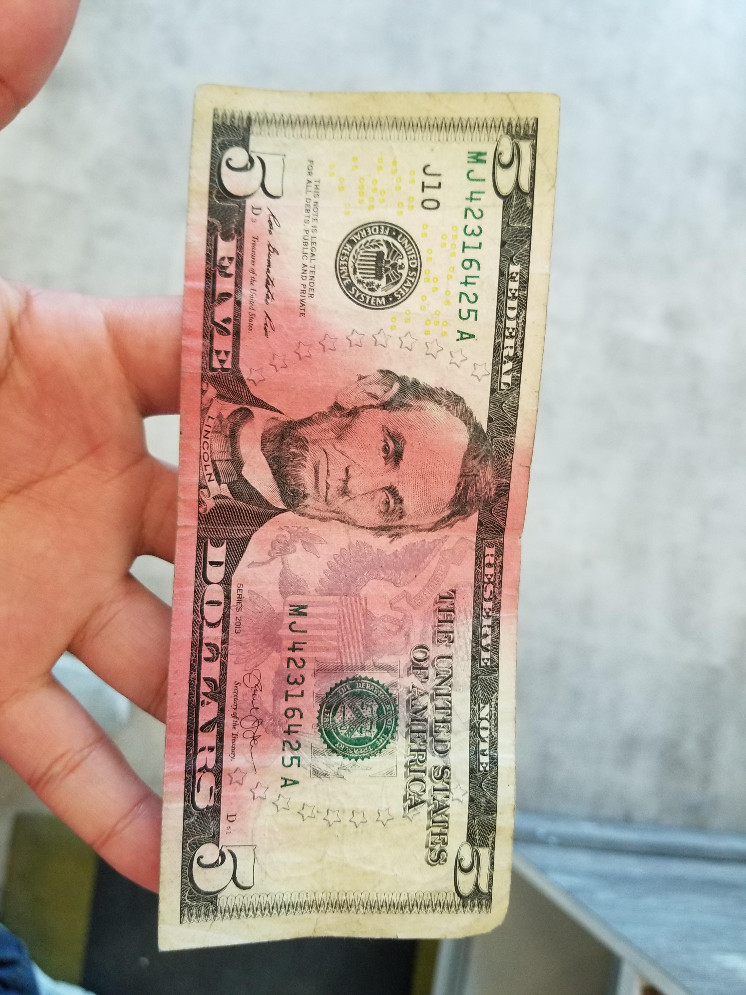 This red stained dollar bill in our register r/mildlyinteresting