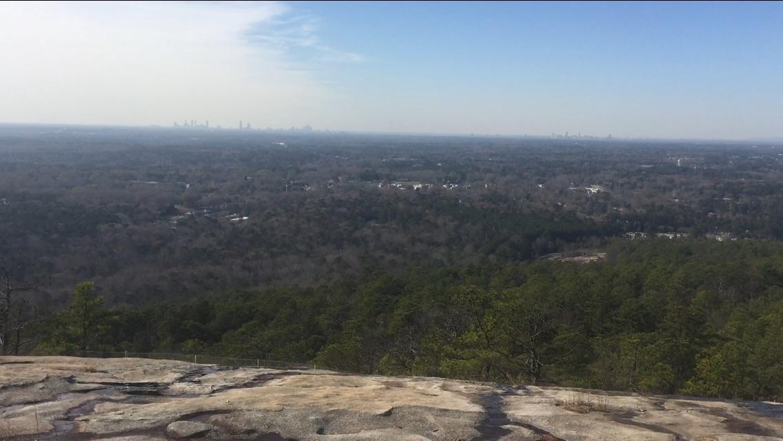 View from the top of Stone Mountain with Atlanta's skyline in the distance r/hiking