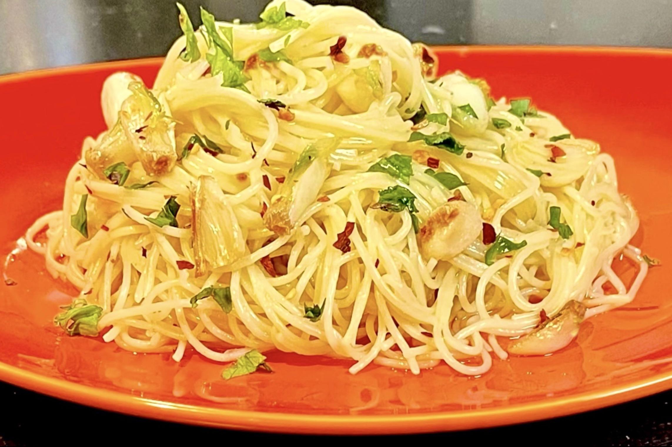 Capellini with sautéed garlic & Olive Oil. Just a simple lunch. r
