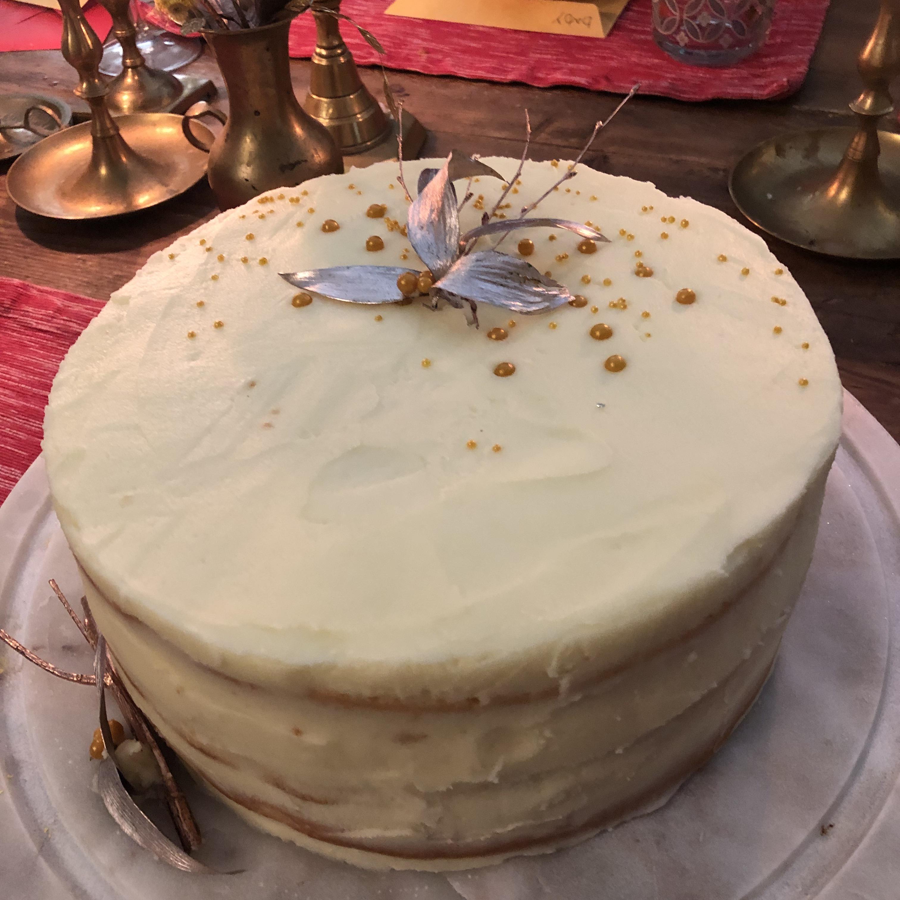 Happy New Years! Champaign cake with buttercream and metallic leaves