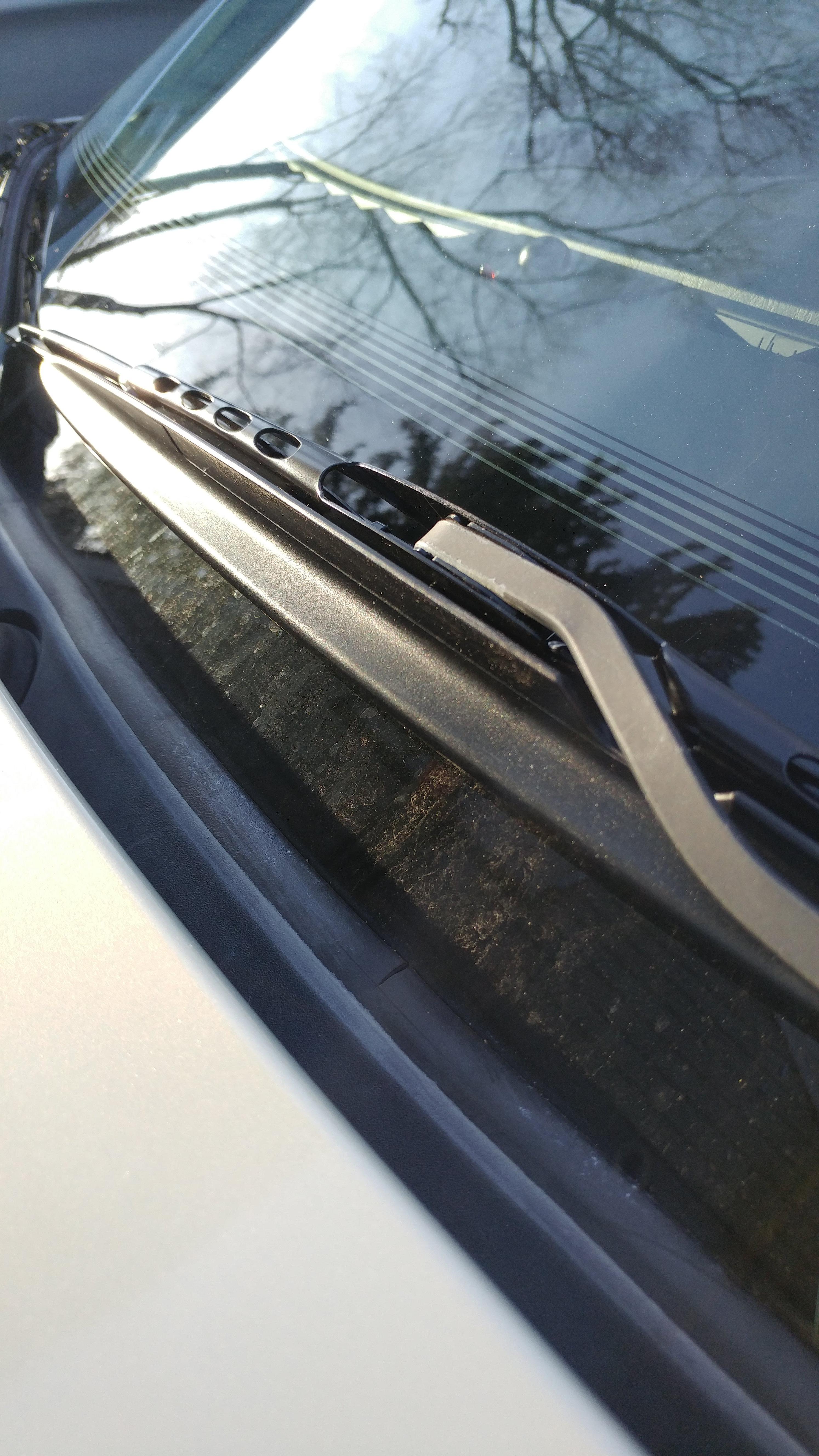 What is this plastic cover on driver side windshield wipers for