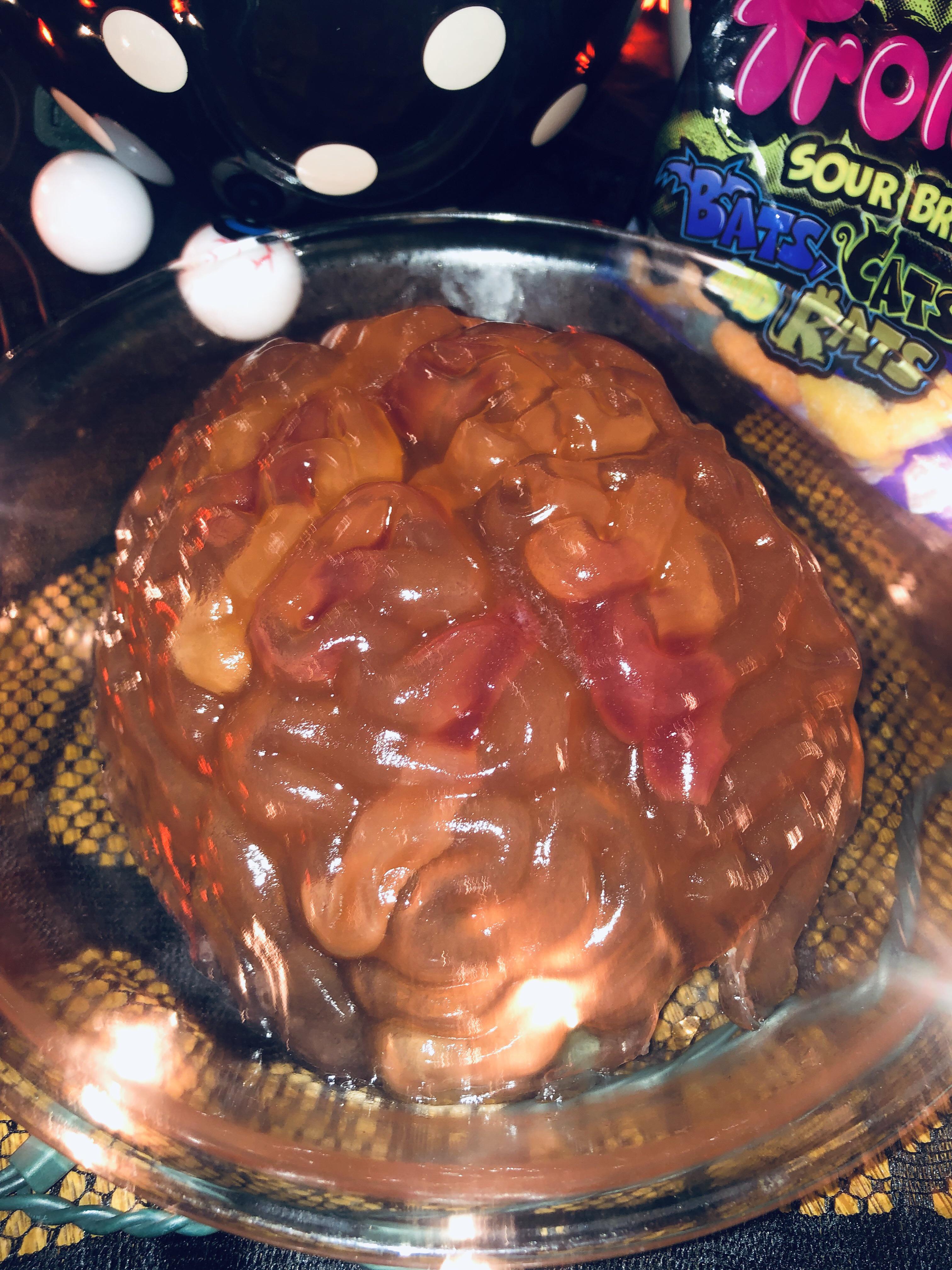 Brain jello mold with gummy worms made for a Halloween party in august