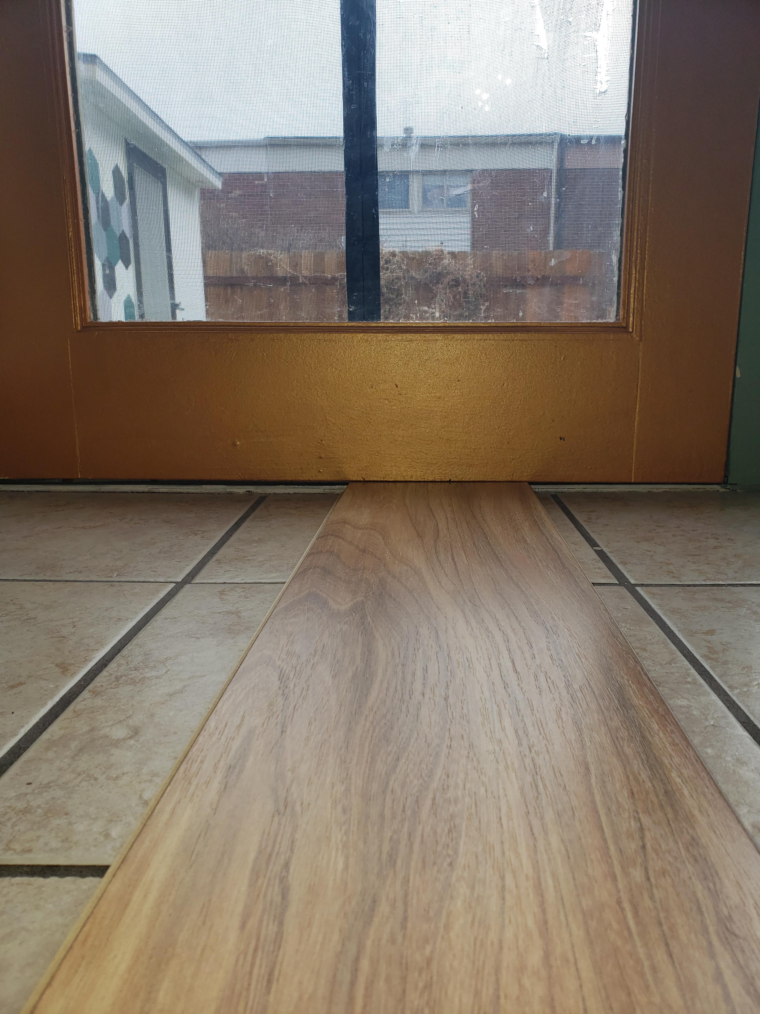 If I add laminate over tile how do I correct the door sag? Left side