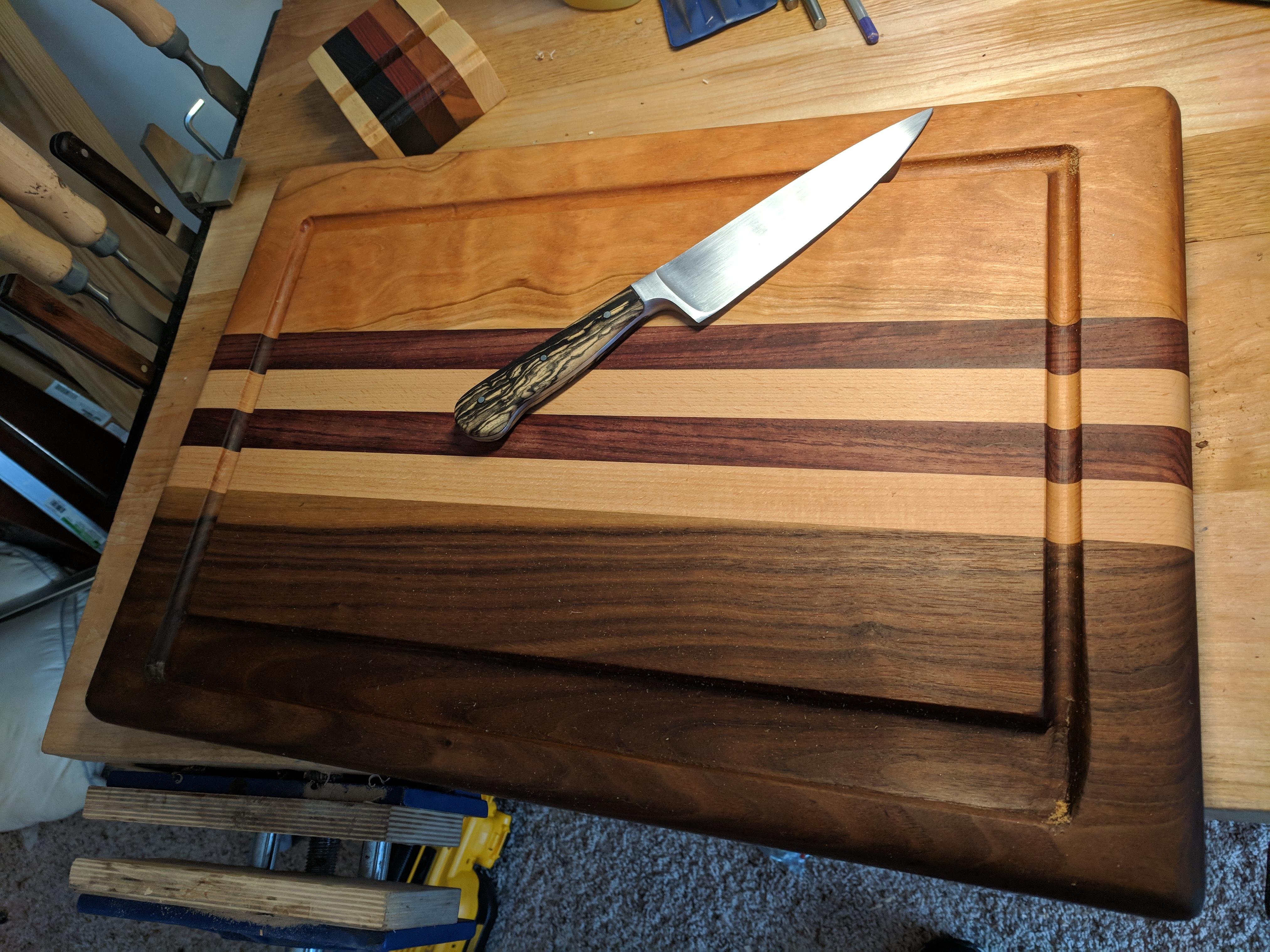 Completed knife handle on top of completed cutting board. Learned much about juice grooves. r